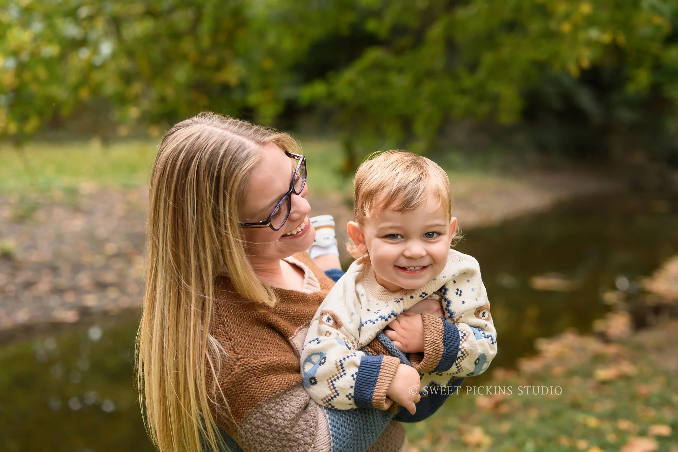 Kokomo, Indiana Fall Family Photography at Highland Park for Mommy and Son in autumn leaves by creek by Sweet Pickins Studio photographer Amanda Wilson ©