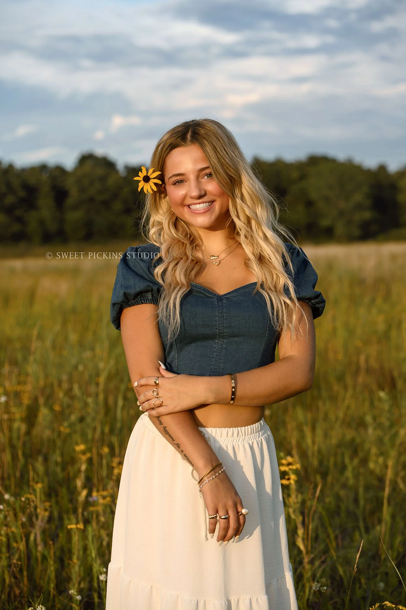 Addison’s Peru, Indiana Country Senior Photography in Prairie Flower Field at Sunset wearing denim top with white flowy skirt in nature location by Sweet Pickins Studio senior photographer Amanda Wilson  ©