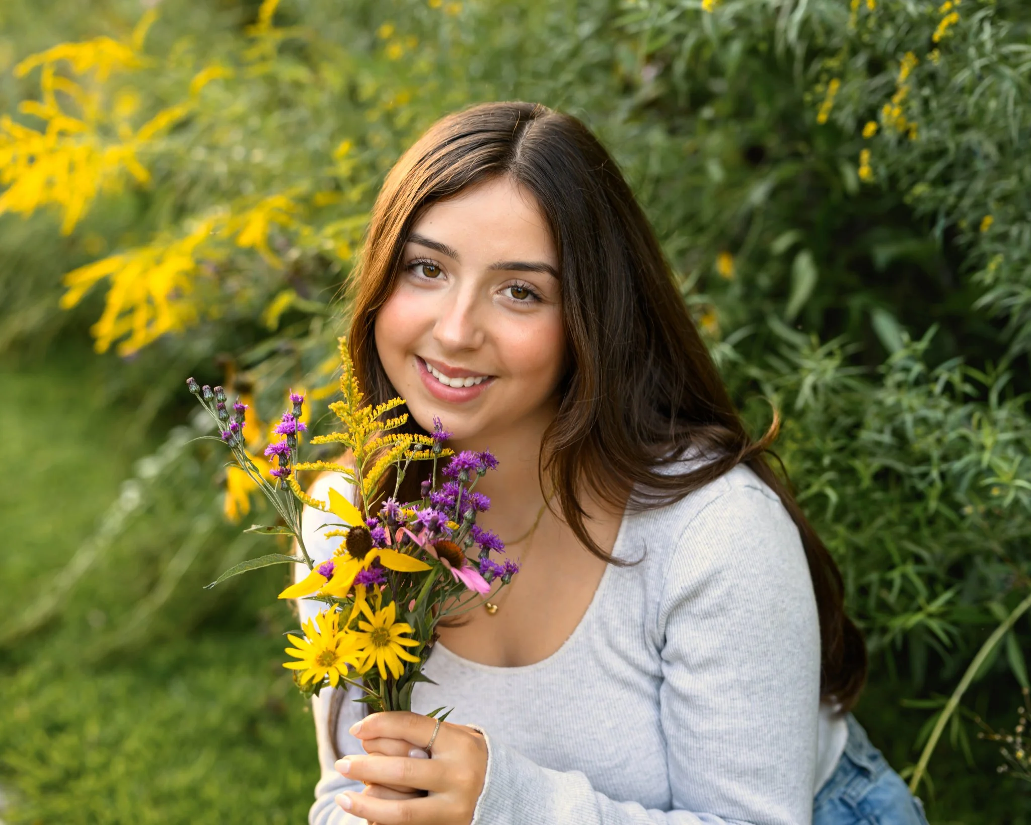 Maisie | Lakeville, Indiana Senior Pictures with wildflowers for Madison East High School class of 2027 senior girl posing in denim jeans and crop top by Peru Indiana senior photographer Amanda Wilson © Sweet Pickins Studio
