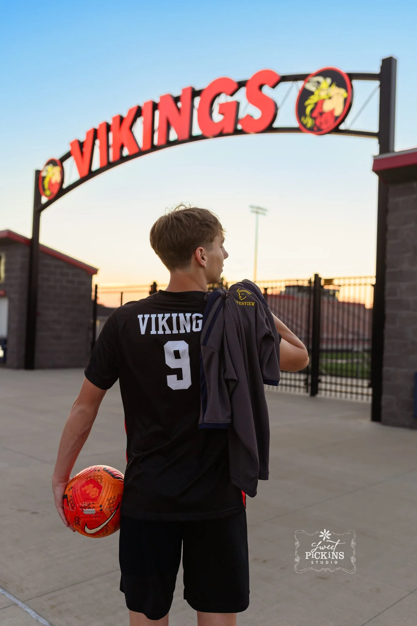 Huntington, Indiana Soccer Senior Photography for Huntington North Class of 2027 sports athlete BOSTAN at stadium by soccer goal by Sweet Pickins Studio senior photographer Amanda Wilson ©
