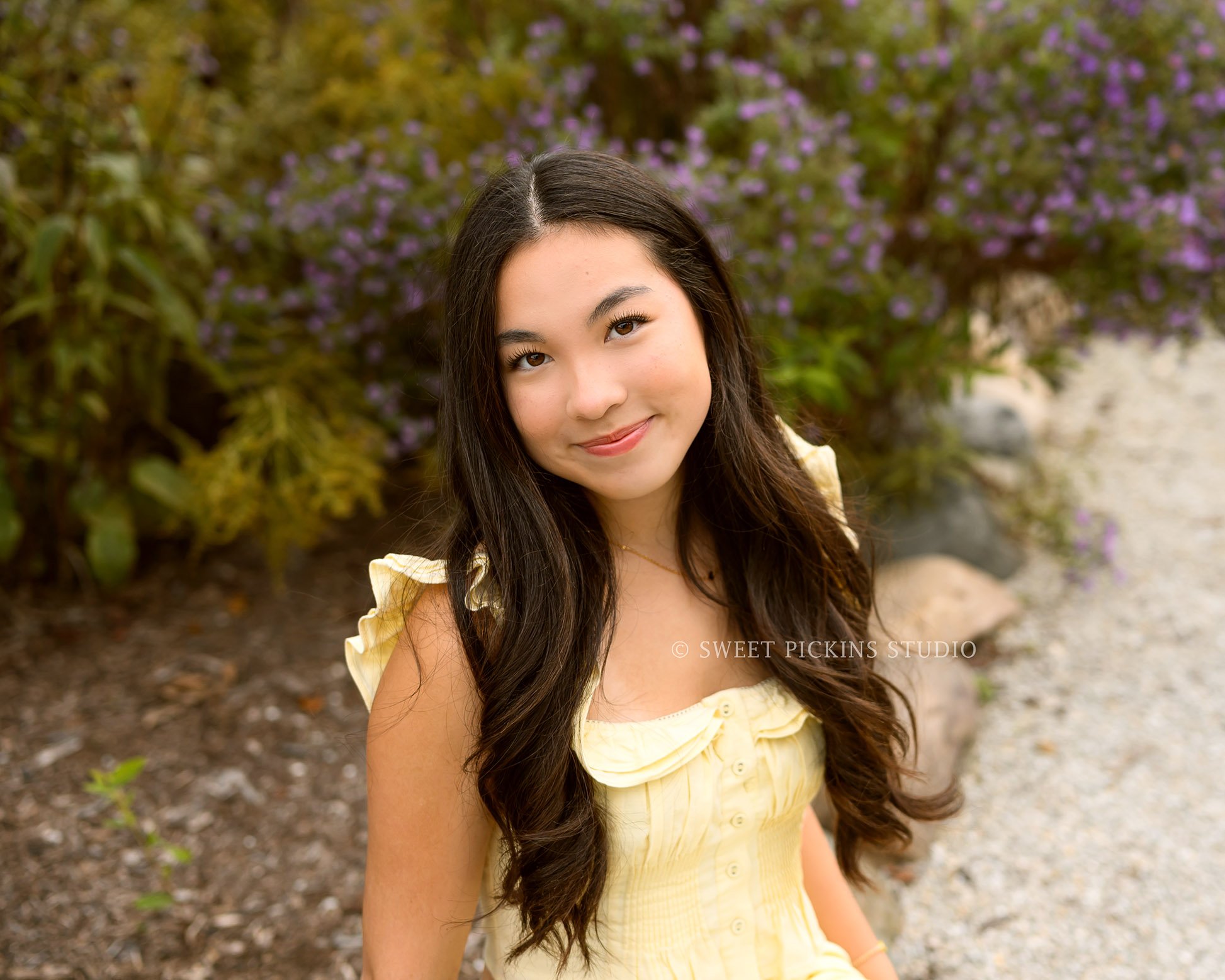 Nora | Carmel, Indiana Fall Senior Girl Photography with purple flowers wearing yellow skirt set for Park Tudor Class of 2027 by Sweet Pickins Studio senior photographer Amanda Wilson ©