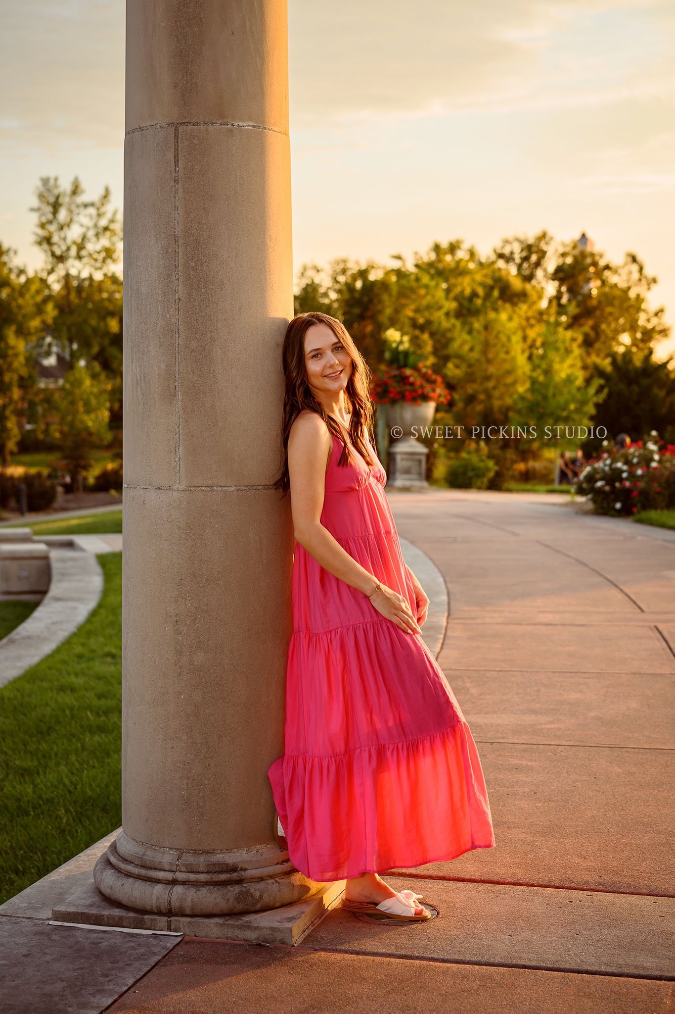 Sophie’s Carmel, Indiana Senior Photography by Sweet Pickins Studio senior photographer Amanda Wilson for class of 2027 Senior girl posing in pink maxi dress at sunset ©