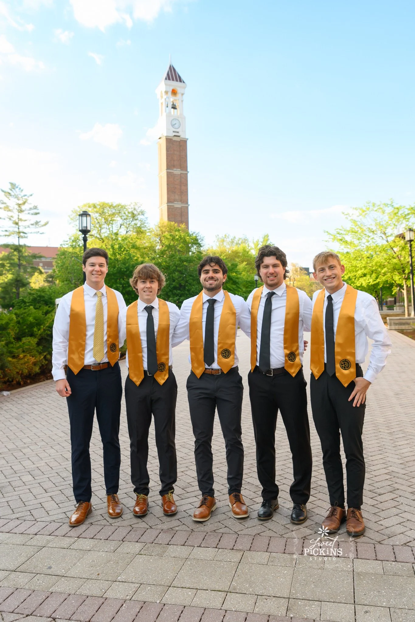 Purdue University Graduation Photography for Five Guy Roommates in Cap and Gown at Clock Tower on college campus by Sweet Pickins Studio senior photographer Amanda Wilson ©