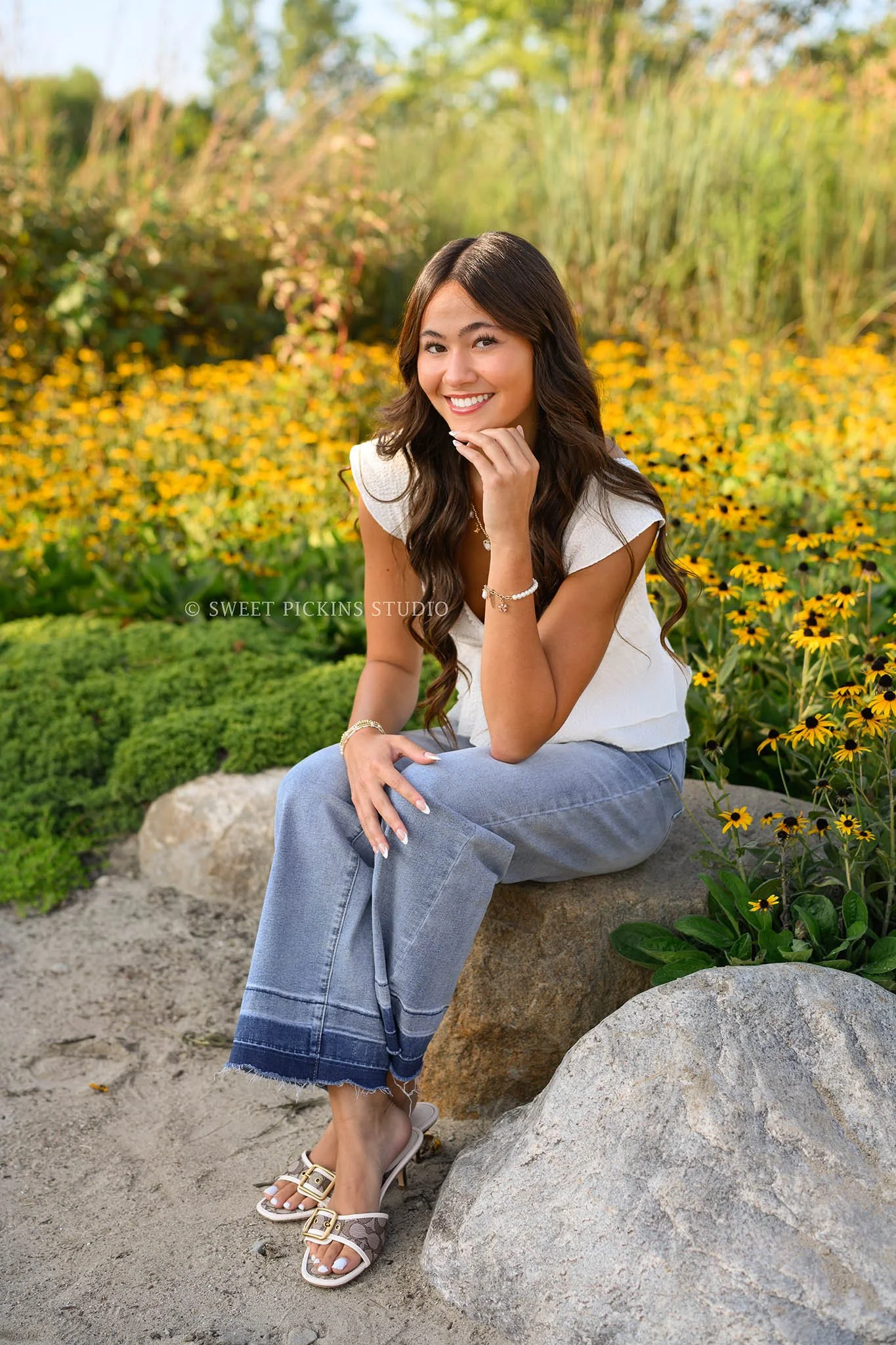 Rachel | Carmel, Indiana Floral Senior Pictures by Yellow Flowers for Class of 2027 senior girl posing in denim jeans and white shirt by Sweet Pickins Studio senior photographer Amanda Wilson ©