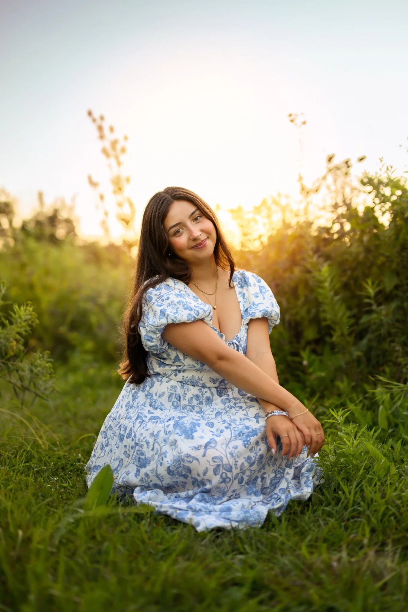 Maisie | Lakeville, Indiana Senior Photography in Field at Sunset for Madison East High School class of 2027 senior girl posing in blue floral dress by Peru Indiana senior photographer Amanda Wilson © Sweet Pickins Studio