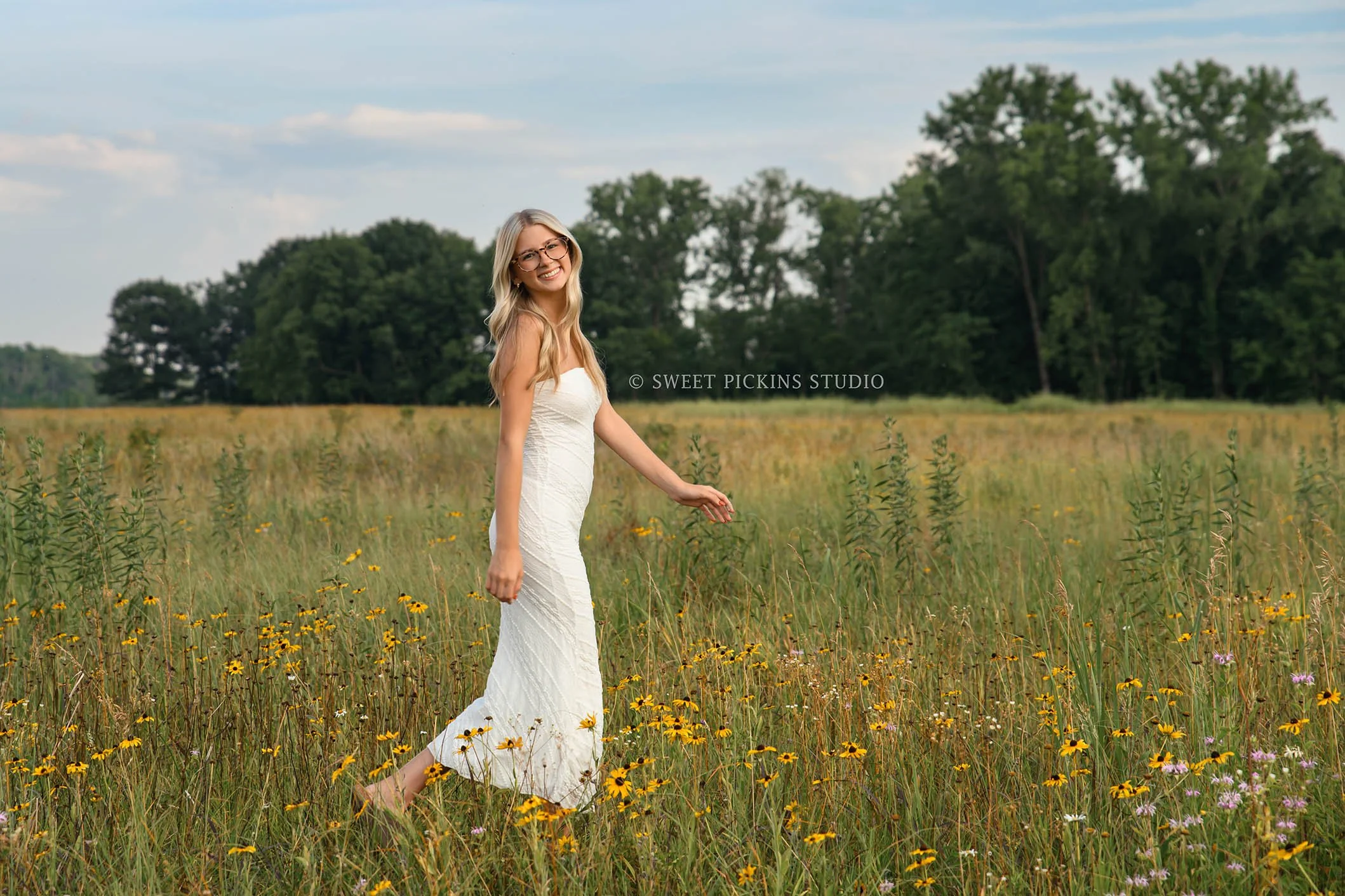 Kyree’s Wildflower Field Senior Picture Photography in Peru, Indiana for Logansport High School Class of 2027 senior girl wearing white long dress in summer by Sweet Pickins Studio senior photographer Amanda Wilson ©