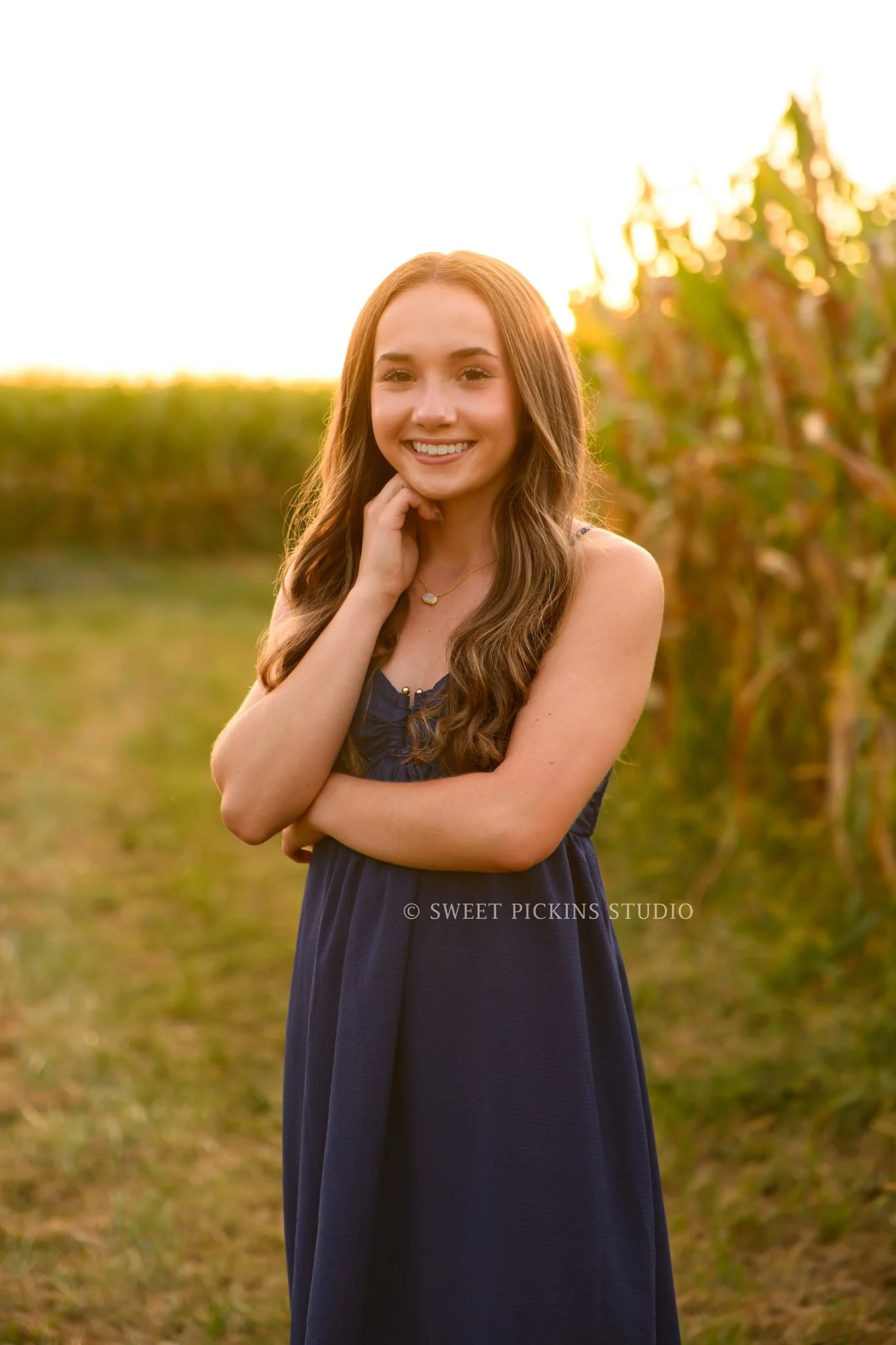 Natalie’s Lowell, Indiana Senior Photography posing by corn on farm at sunset by Sweet Pickins Studio senior photographer Amanda Wilson ©