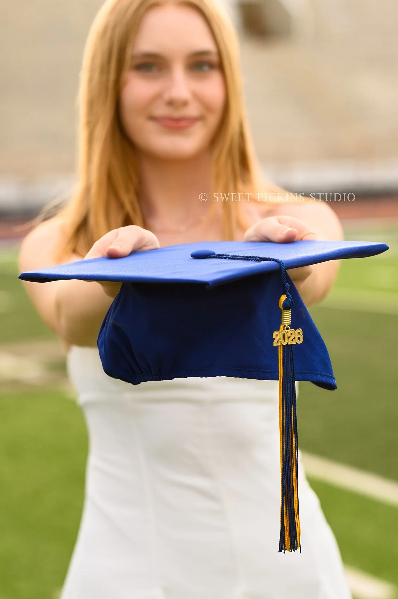Holly and Taylor’s Carmel High School Graduation Pictures in Cap and Gown at Stadium by Sweet Pickins Studio senior photographer Amanda Wilson ©