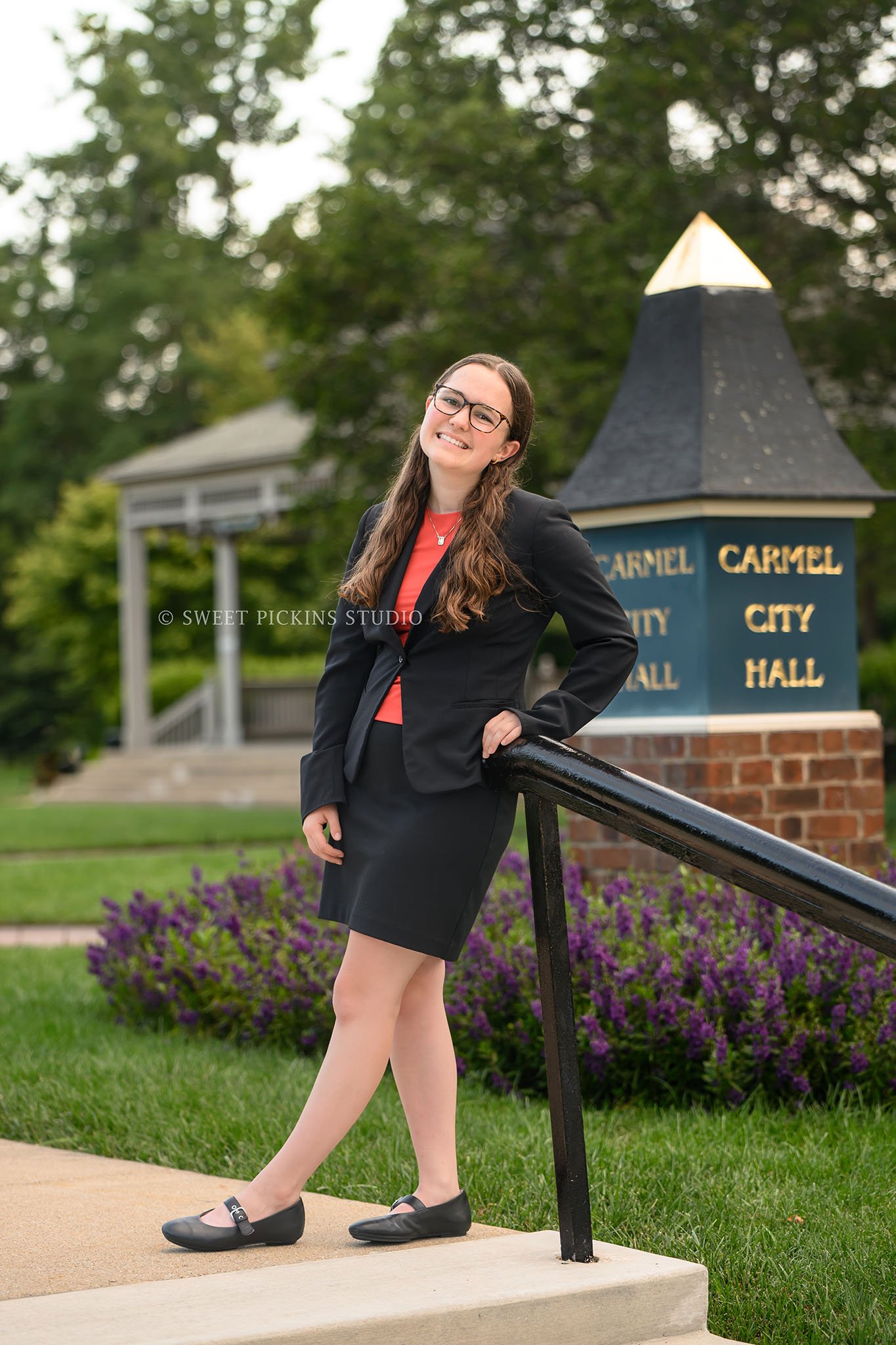 Downtown Carmel, Indiana Senior Photography for Class of 2027 Senior Ellen at City Hall wearing business suit in summer by Sweet Pickins Studio senior photographer Amanda Wilson ©