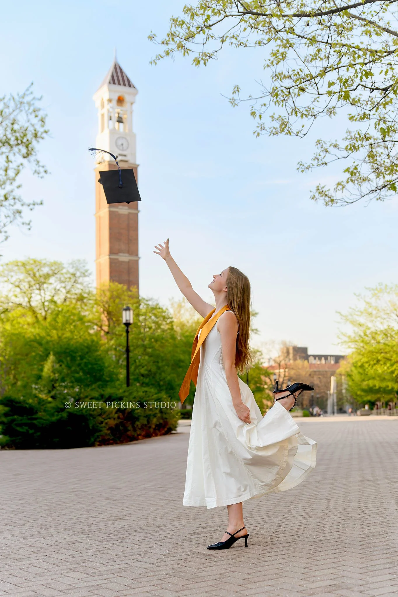 Maggie’s Purdue University Graduation Cap Toss at Bell Tower in West Lafayette, Indiana by Sweet Pickins Studio senior photographer Amanda Wilson ©