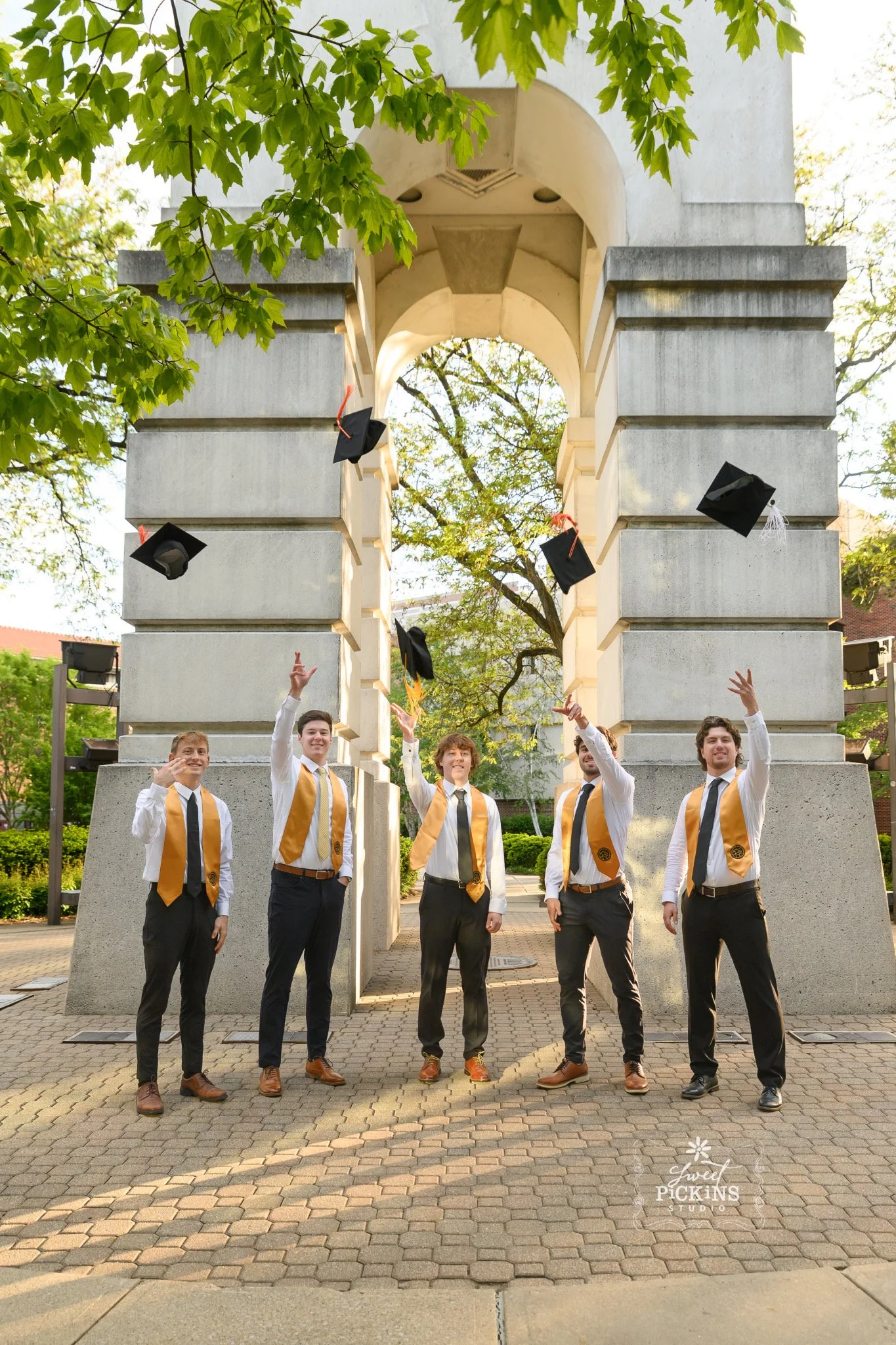 Purdue University Graduation Photography for Guys in Cap and Gown at bell tower on college campus by Sweet Pickins Studio senior photographer Amanda Wilson ©