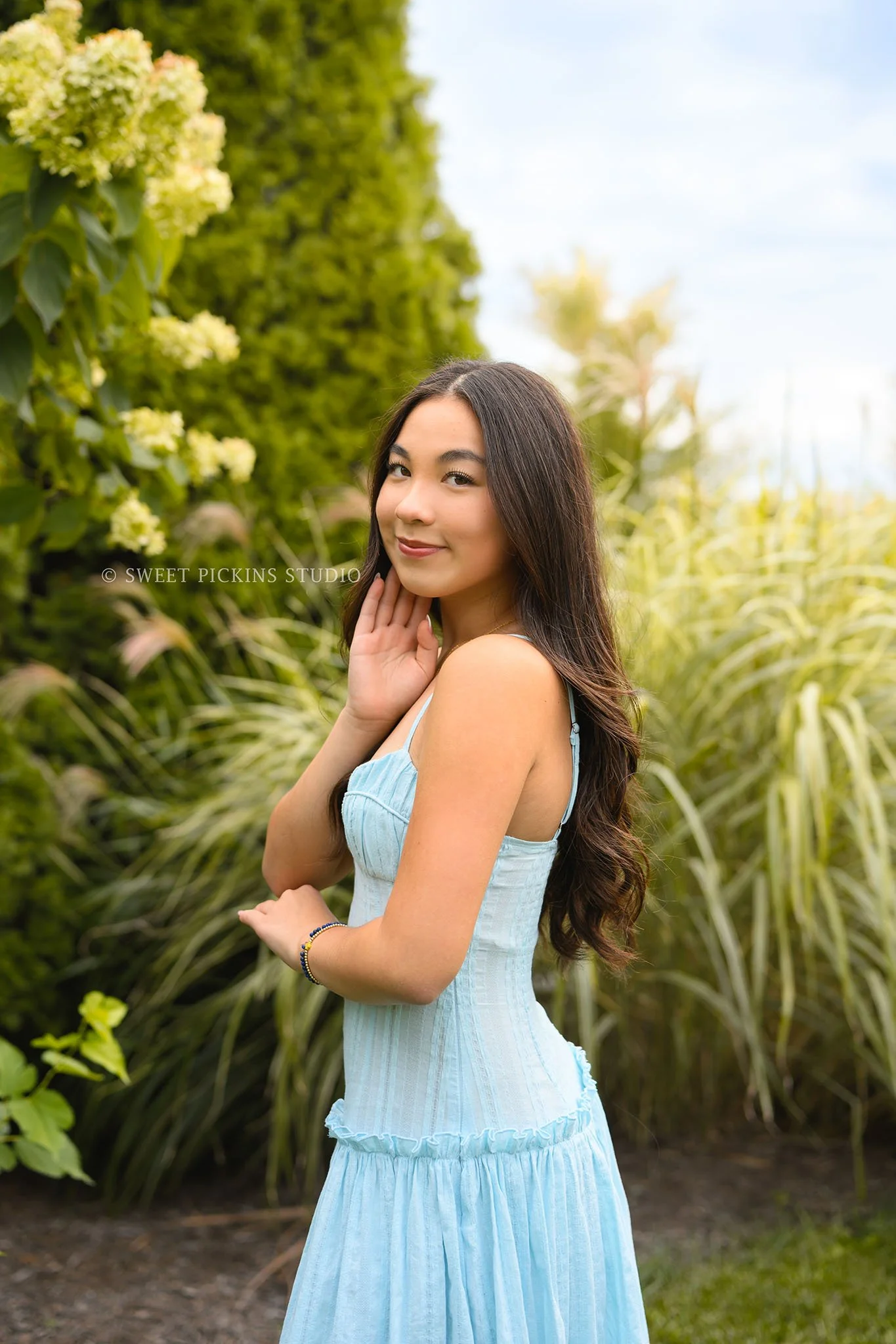 Nora | Carmel, Indiana Senior Photography in Garden posing in blue dress for Park Tudor Class of 2027 by Sweet Pickins Studio senior photographer Amanda Wilson ©