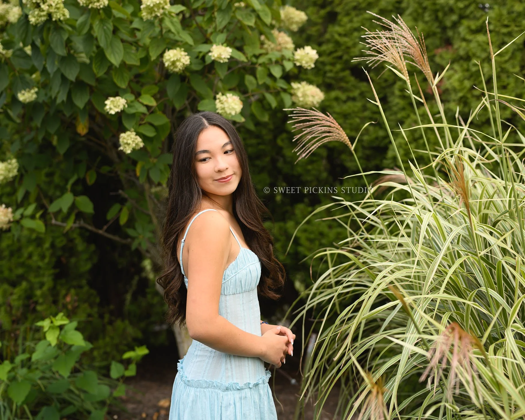 Nora | Carmel, Indiana Senior Photography in Garden posing in blue dress for Park Tudor Class of 2027 by Sweet Pickins Studio senior photographer Amanda Wilson ©