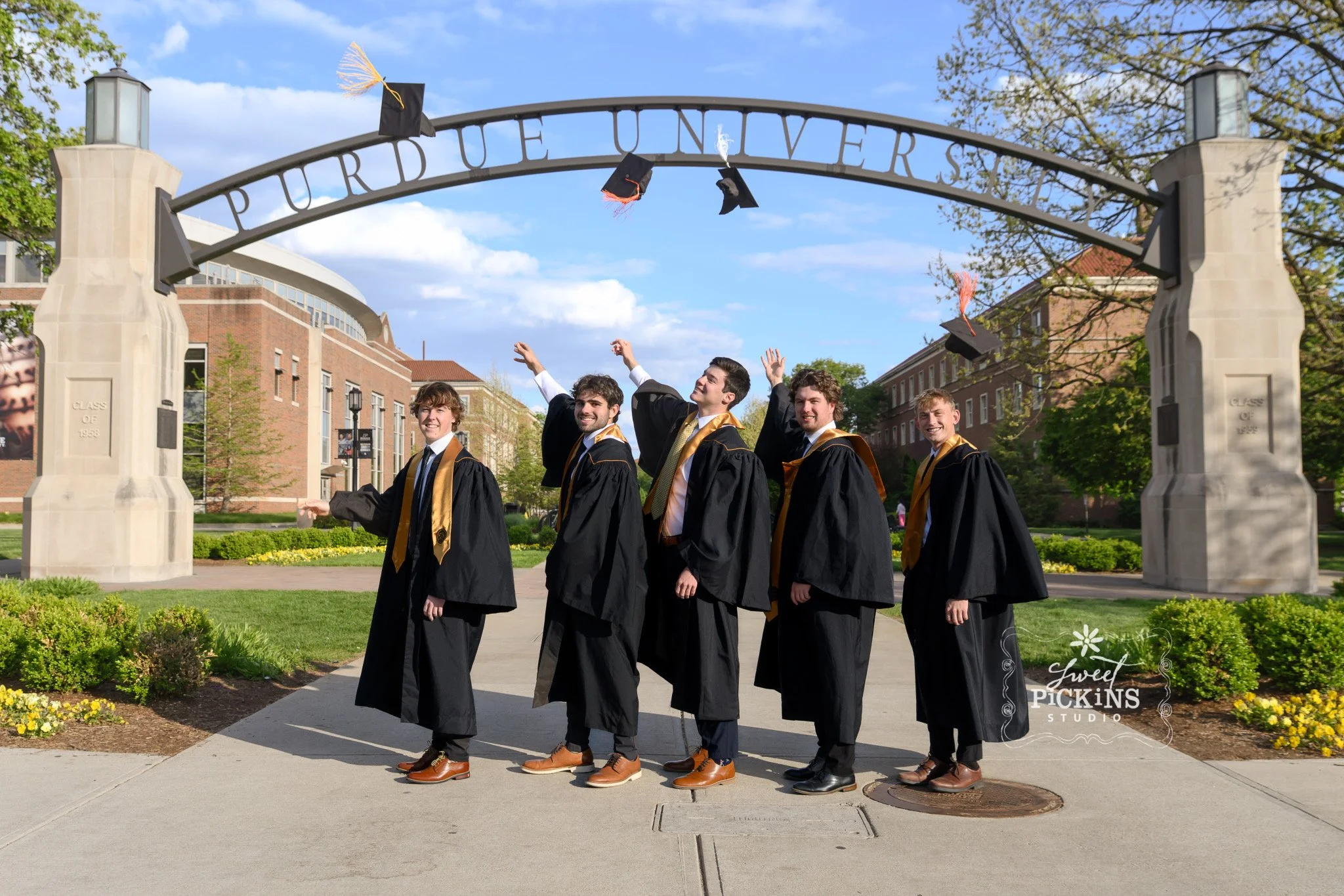 Purdue University Graduation Photography for Five Guy Roommates in Cap and Gown at Armstrong Arch by Sweet Pickins Studio senior photographer Amanda Wilson ©