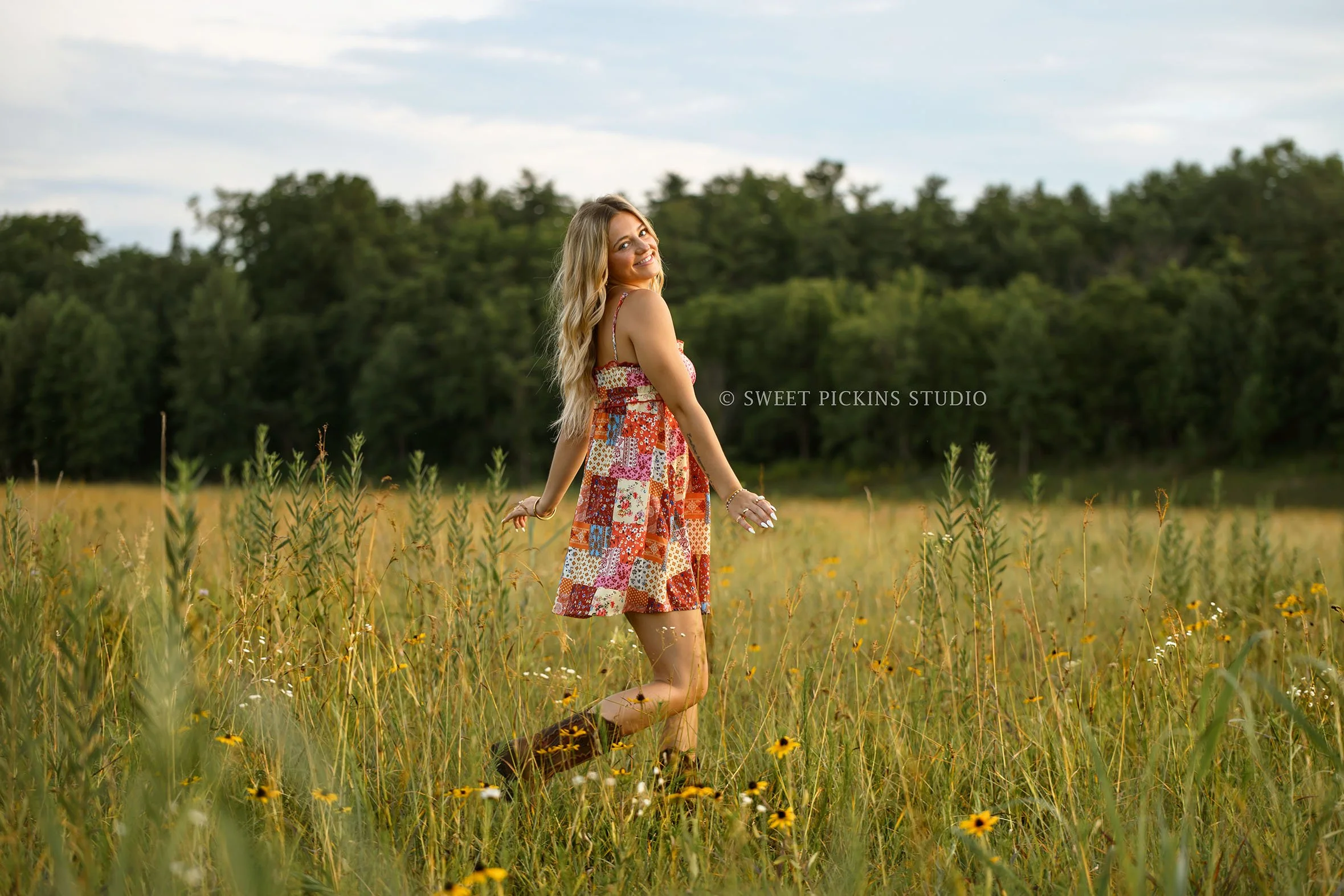 Addison’s Peru, Indiana Senior Photography in Wildflower Field at Sunset wearing patchwork babydoll dress with western cowboy boots in country location by Sweet Pickins Studio senior photographer Amanda Wilson  ©