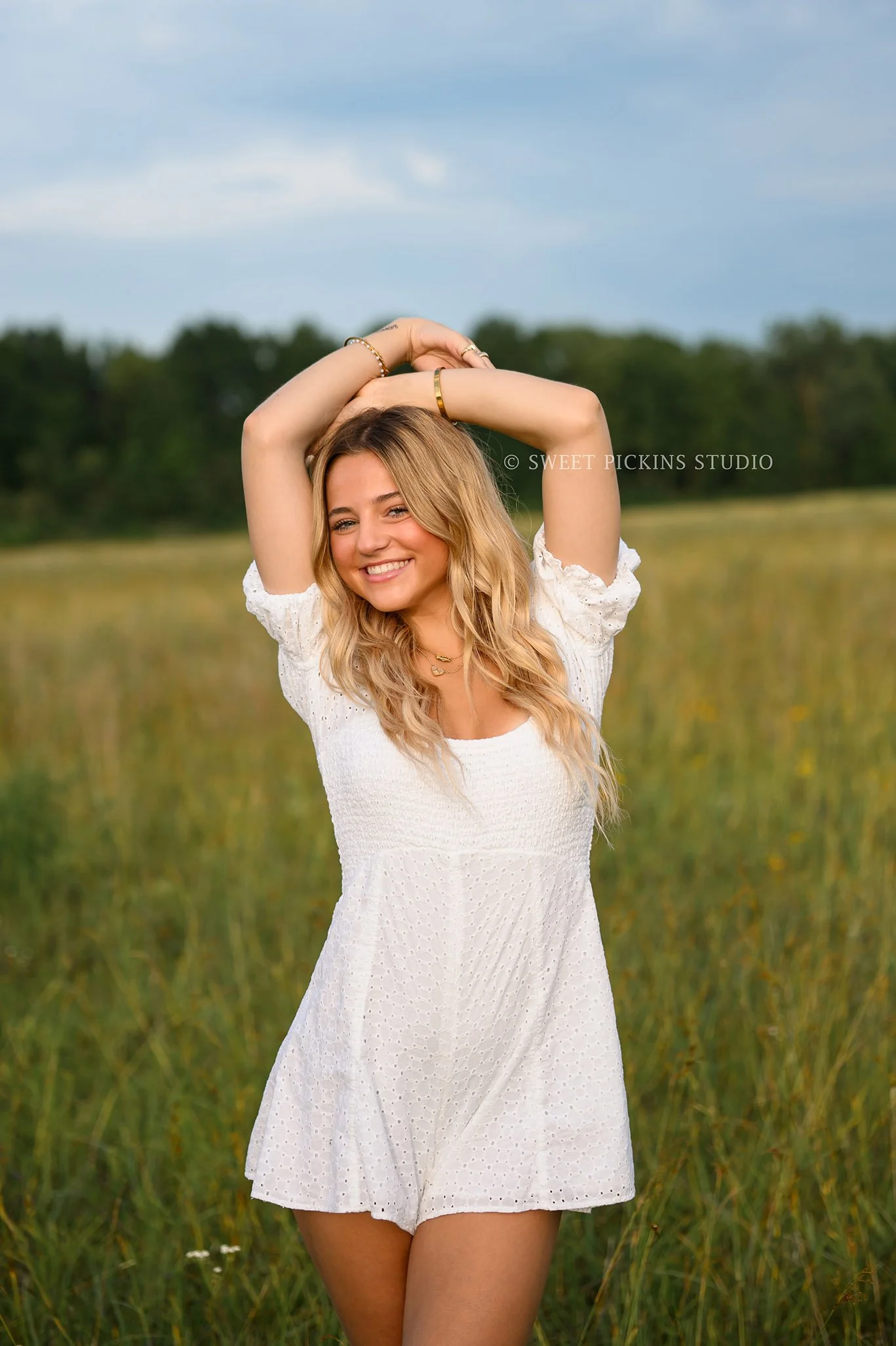 Addison’s Peru, Indiana Country Senior Photography in Prairie Flower Field at Sunset wearing white romper and western boots in summer by Sweet Pickins Studio senior photographer Amanda Wilson  ©