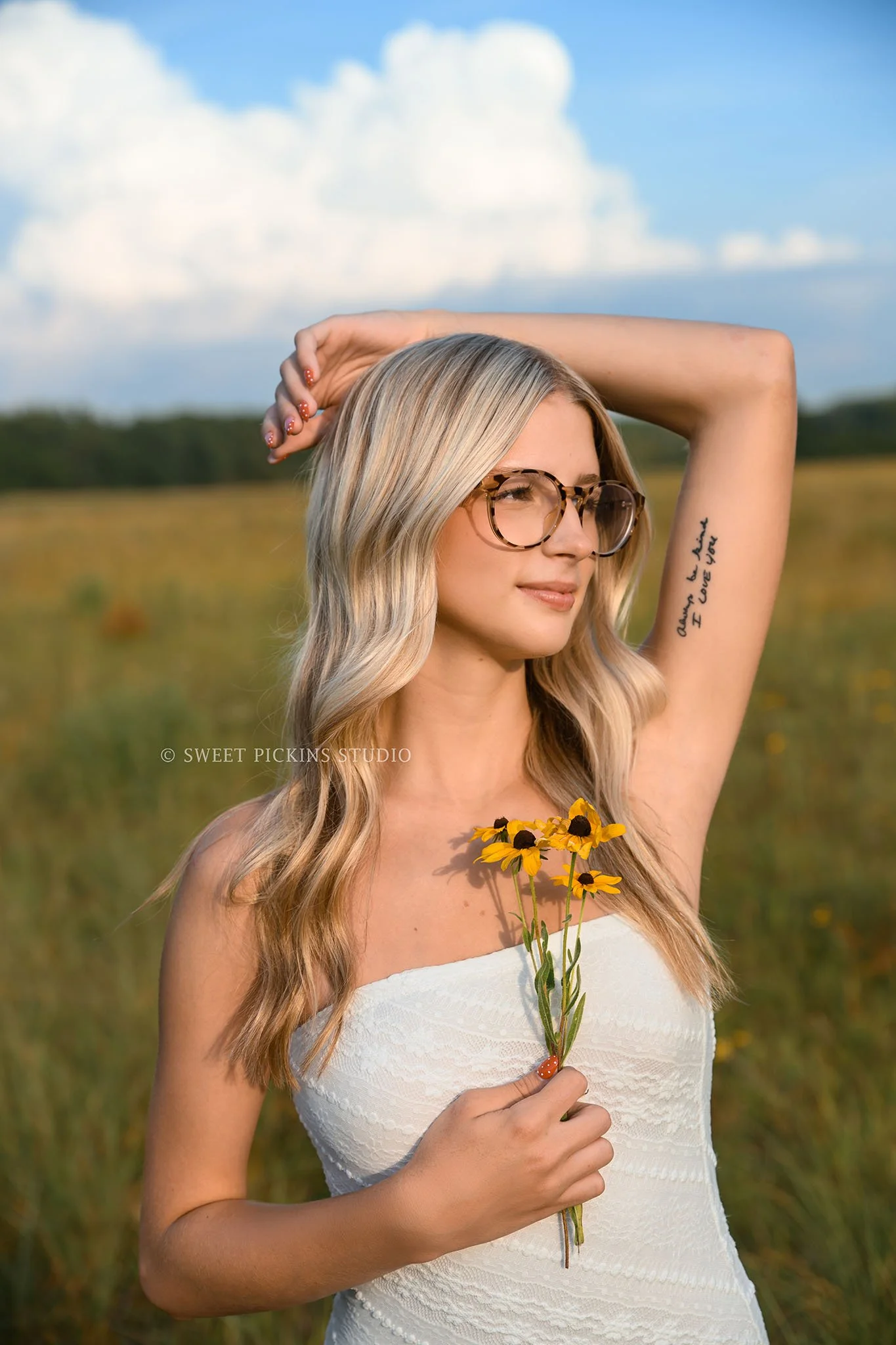 Kyree’s Wildflower Field Senior Picture Photography in Peru, Indiana for Logansport High School Class of 2027 senior girl wearing white long dress in summer by Sweet Pickins Studio senior photographer Amanda Wilson ©