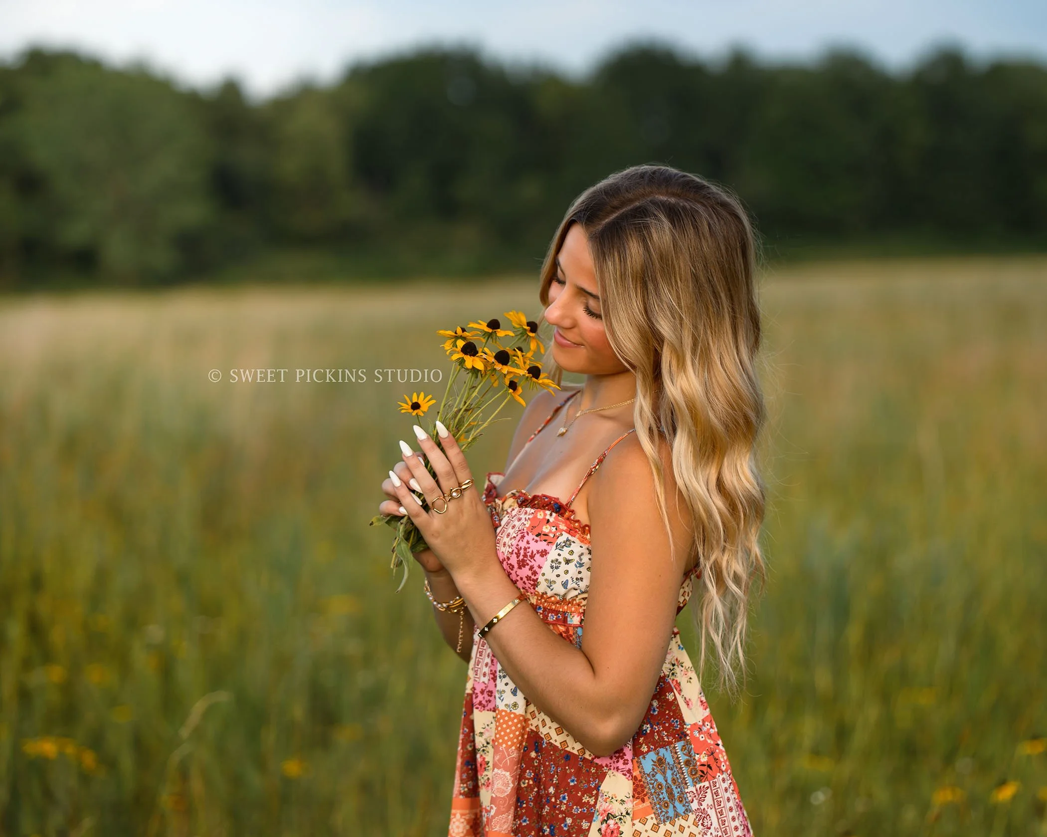 Addison’s Peru, Indiana Senior Photography in Wildflower Field at Sunset wearing patchwork babydoll dress with western cowboy boots in country location by Sweet Pickins Studio senior photographer Amanda Wilson  ©