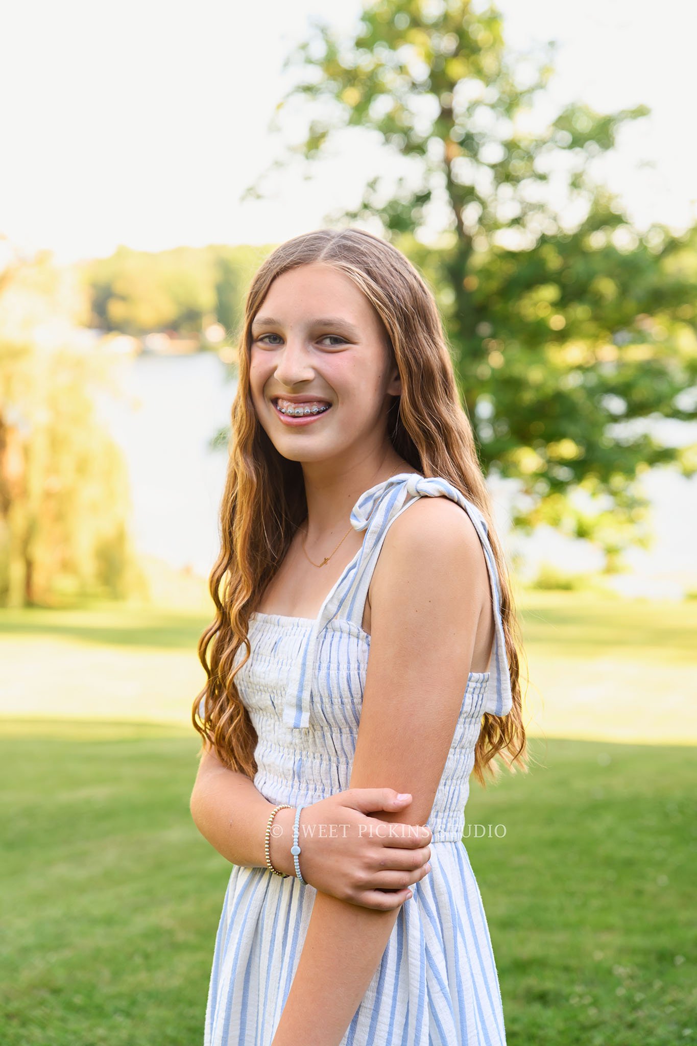 Roann, Indiana Family Portrait Photography of girl wearing blue and white summer dress outfit at Luken’s Lake outdoor nature location in summer by Sweet Pickins Studio family photographer Amanda Wilson ©
