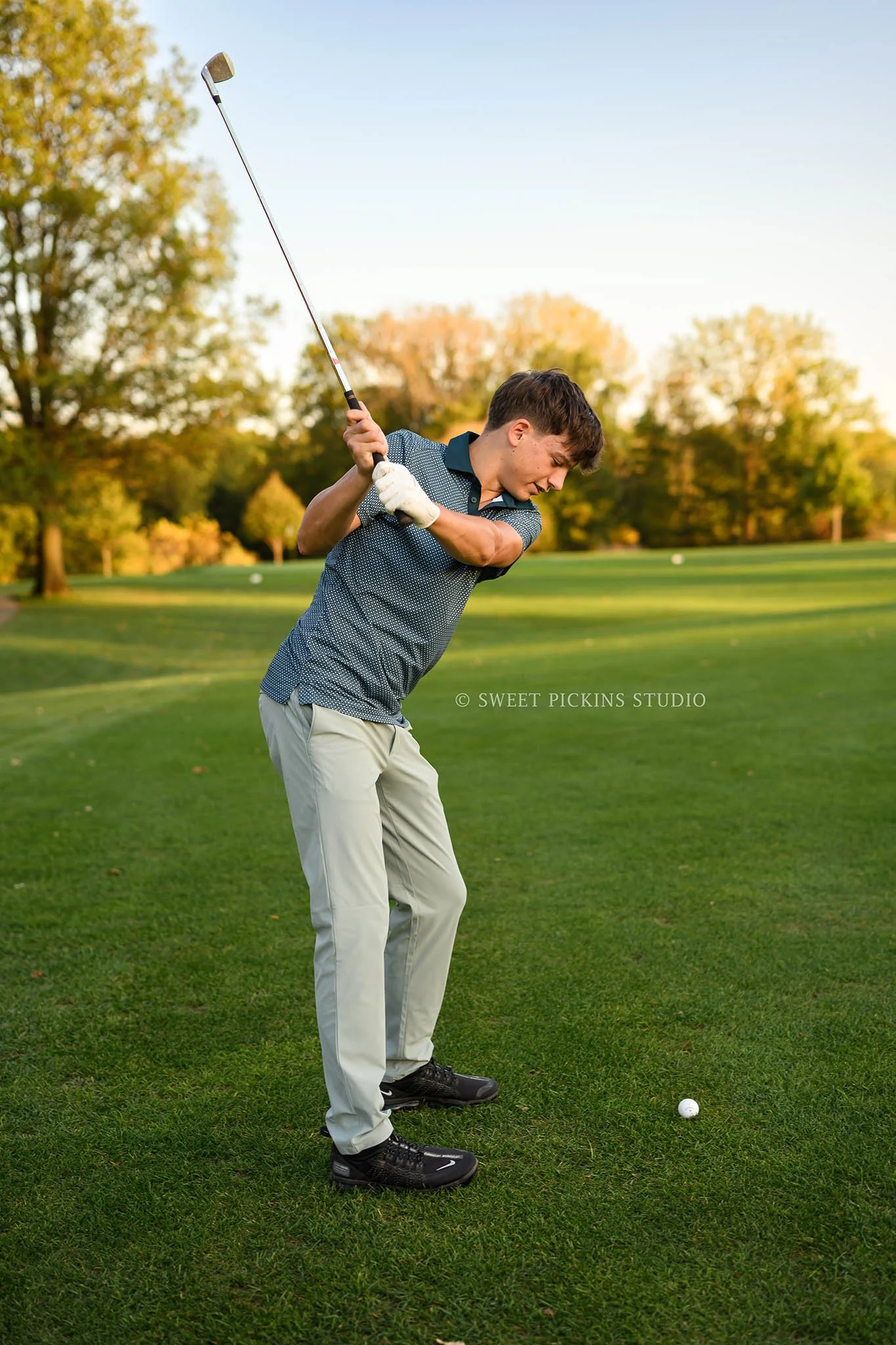 Cohen | Peru, Indiana Golf Senior Photography in Fall for Maconaquah High School Class of 2027 senior guy posing on golf course with driver by Sweet Pickins Studio senior photographer Amanda Wilson ©
