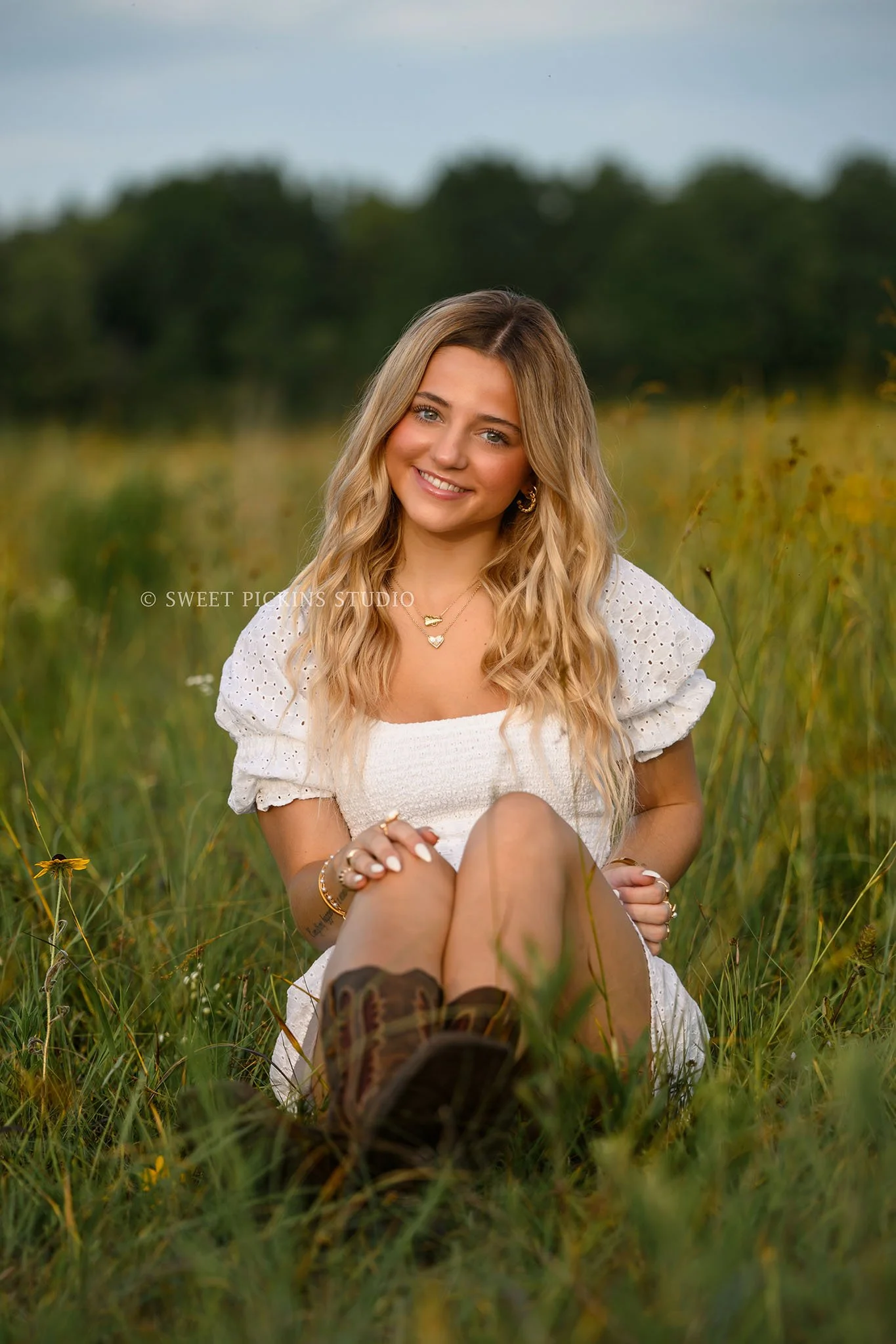 Addison’s Peru, Indiana Country Senior Photography in Prairie Flower Field at Sunset wearing white romper and western boots in summer by Sweet Pickins Studio senior photographer Amanda Wilson  ©