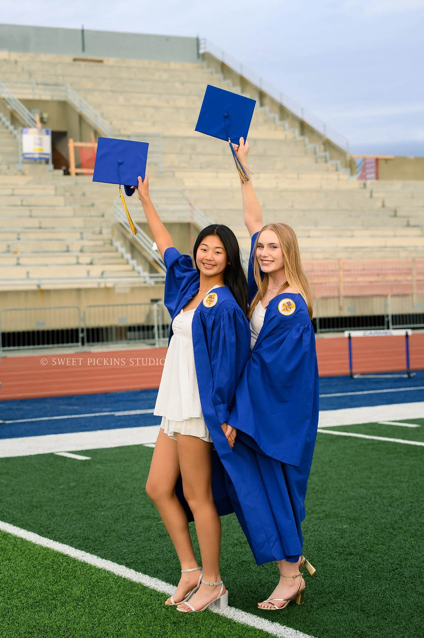 Holly and Taylor’s Carmel High School Graduation Photography in Cap and Gown at Stadium by Sweet Pickins Studio senior photographer Amanda Wilson ©