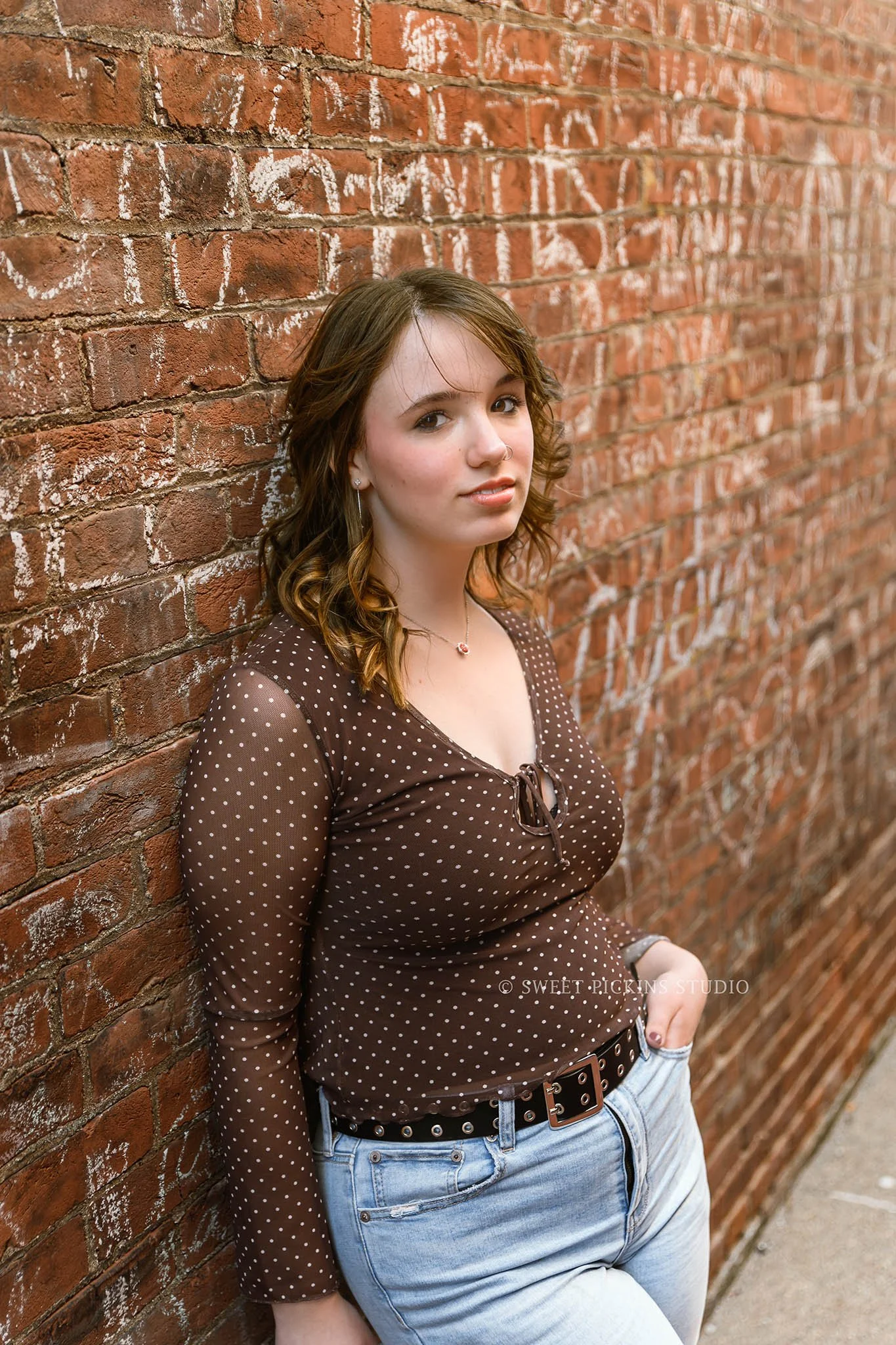 Hailee | Noblesville, Indiana Senior Portrait Photography in Urban Downtown for Noblesville High School class of 2026 senior girl in brick graffitti alley by Sweet Pickins Studio senior photographer Amanda Wilson © 2026