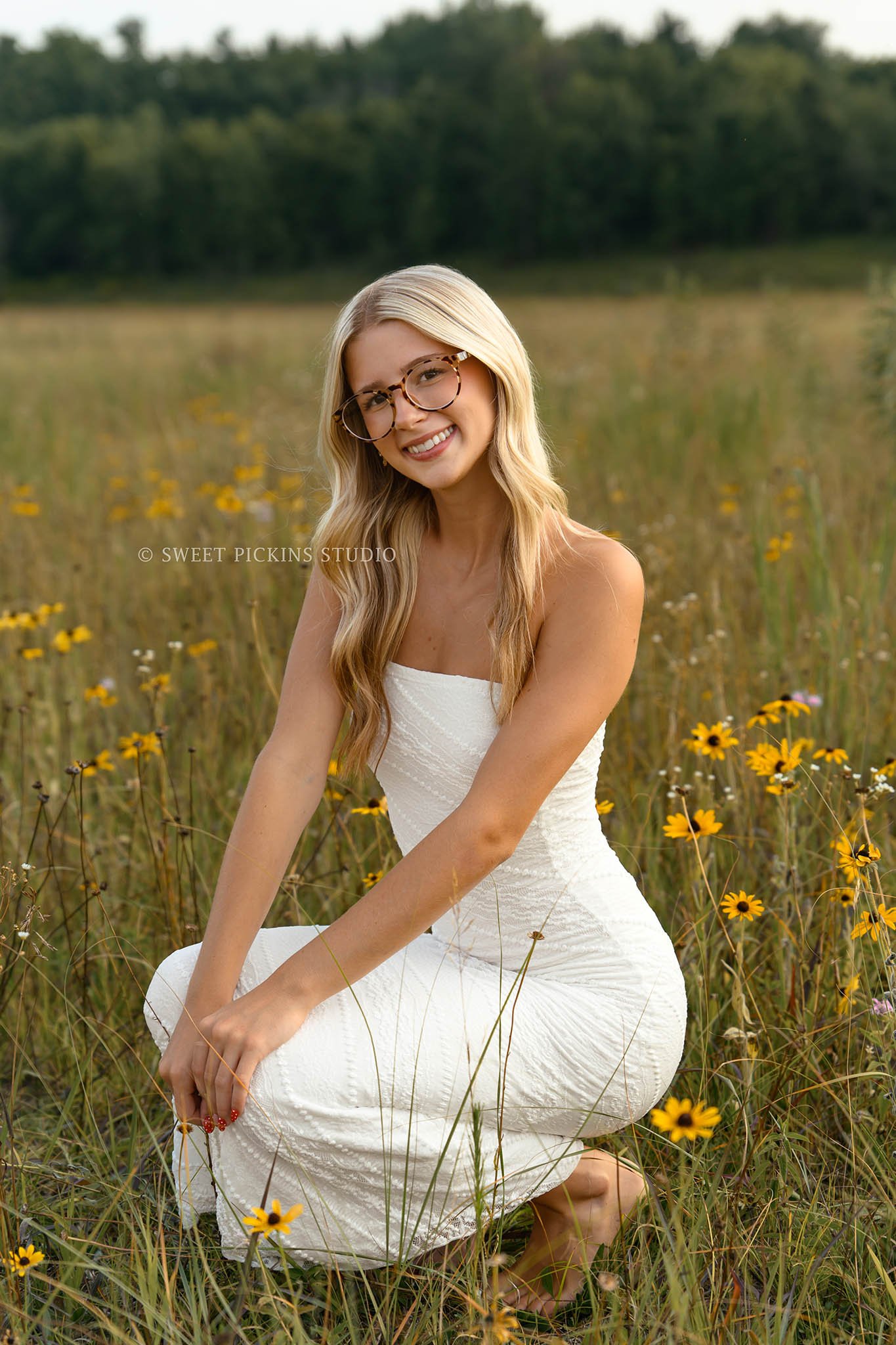 Kyree’s Flower Field Senior Picture Photography in Peru, Indiana for Logansport High School Class of 2027 senior girl wearing white long dress in summer by Sweet Pickins Studio senior photographer Amanda Wilson ©