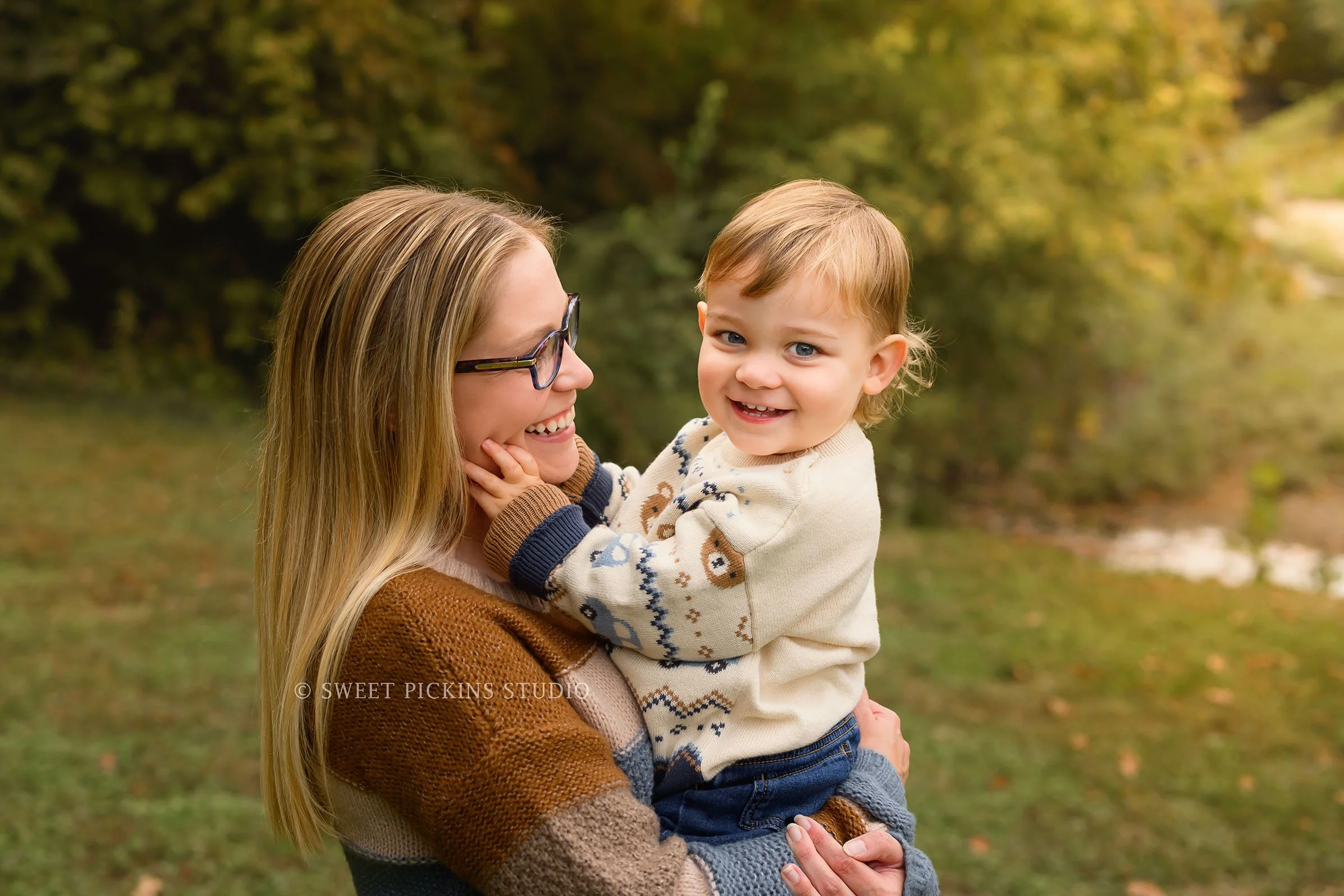 Kokomo, Indiana Fall Family Photography at Highland Park for Mommy and Son walking in autumn leaves by creek by Sweet Pickins Studio photographer Amanda Wilson ©