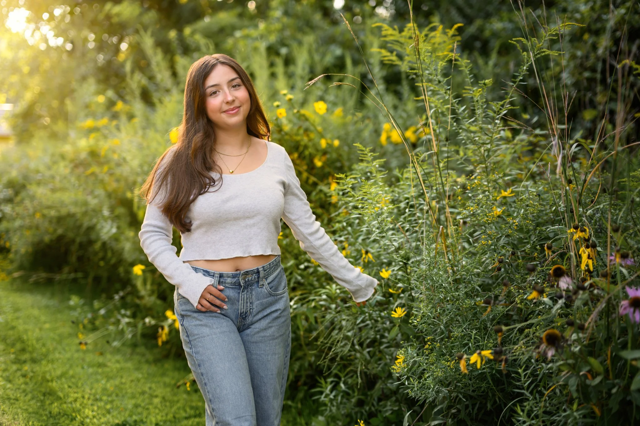 Maisie | Lakeville, Indiana Senior Portrait Photography in Flower Field for Madison East High School class of 2027 senior girl wearing denim jeans and crop top by Peru Indiana senior photographer Amanda Wilson © Sweet Pickins Studio