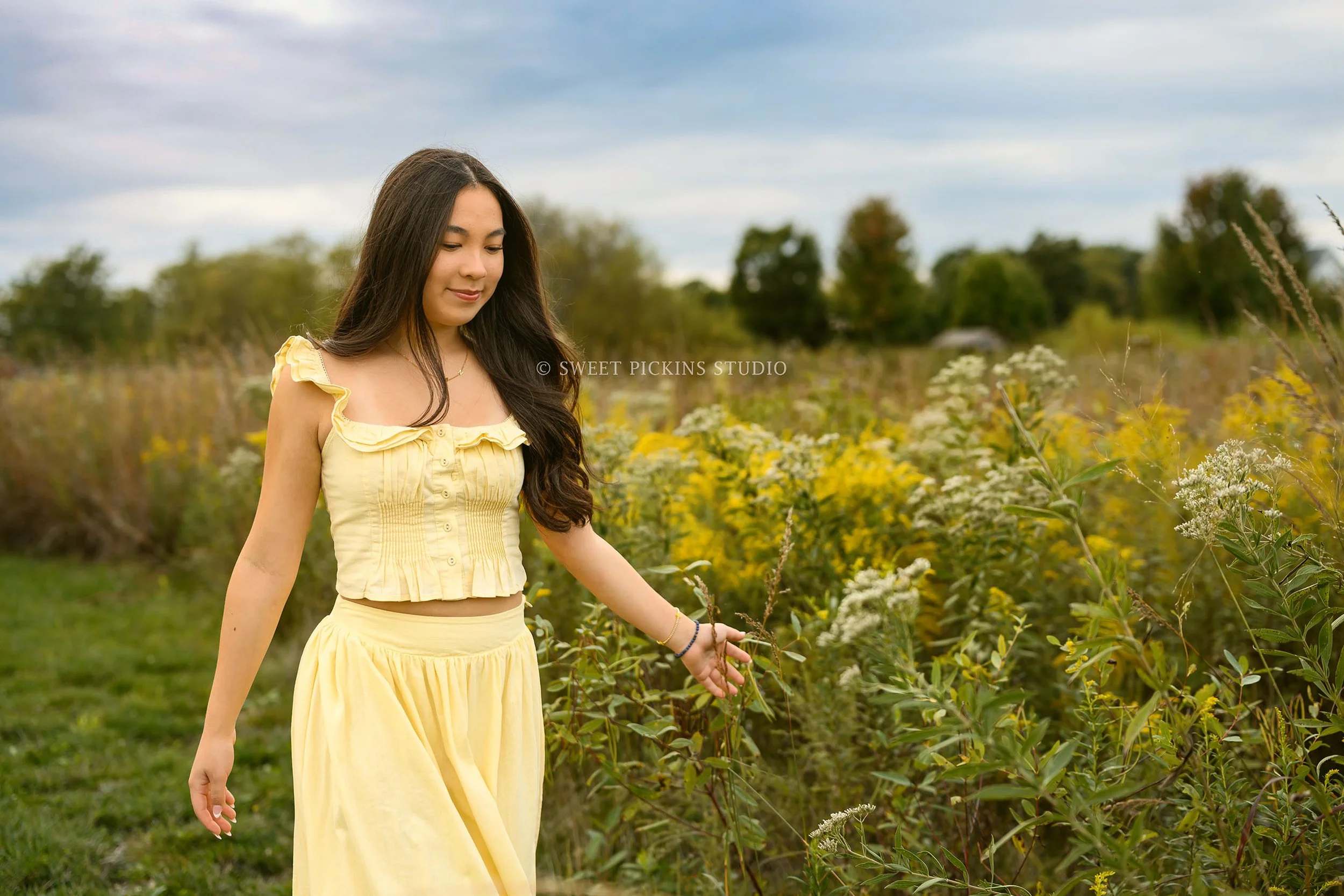 Nora | Carmel, Indiana Senior Girl Photography in Fall yellow wildflower field wearing yellow skirt set for Park Tudor Class of 2027 by Sweet Pickins Studio senior photographer Amanda Wilson ©