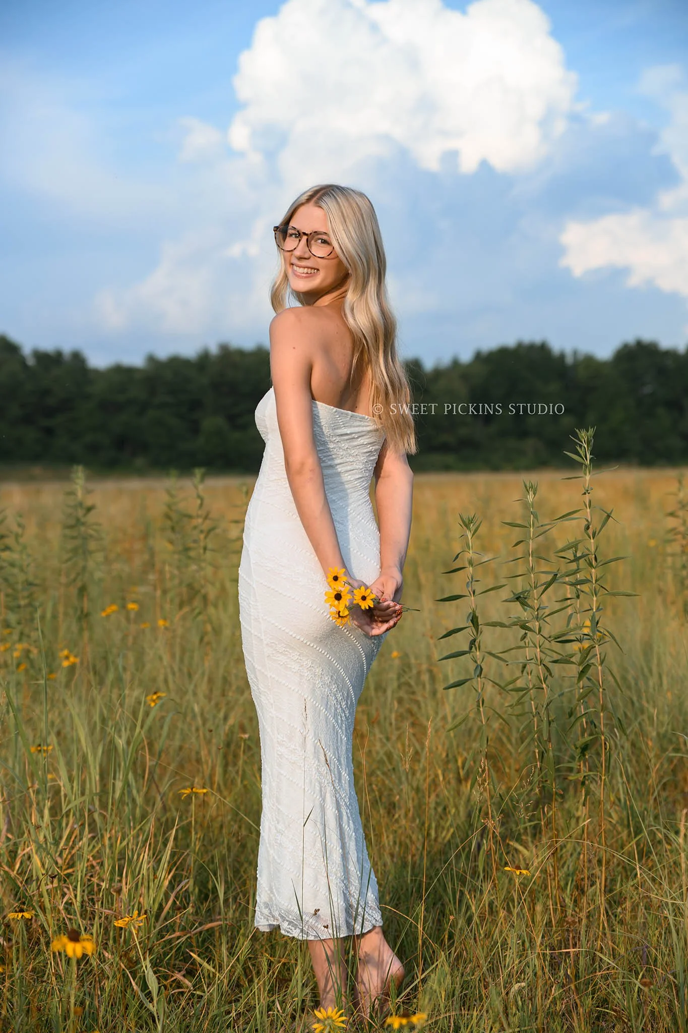 Kyree’s Flower Field Senior Picture Photography in Peru, Indiana for Logansport High School Class of 2027 senior girl wearing white long dress in summer by Sweet Pickins Studio senior photographer Amanda Wilson ©