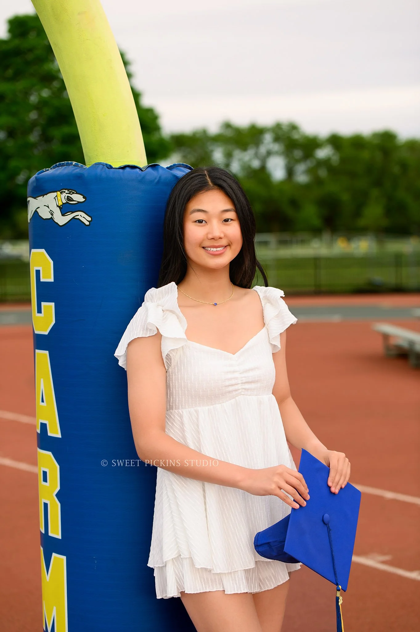 Holly and Taylor’s Carmel High School Graduation Portrait Photography in Cap and Gown at Stadium by Sweet Pickins Studio senior photographer Amanda Wilson ©