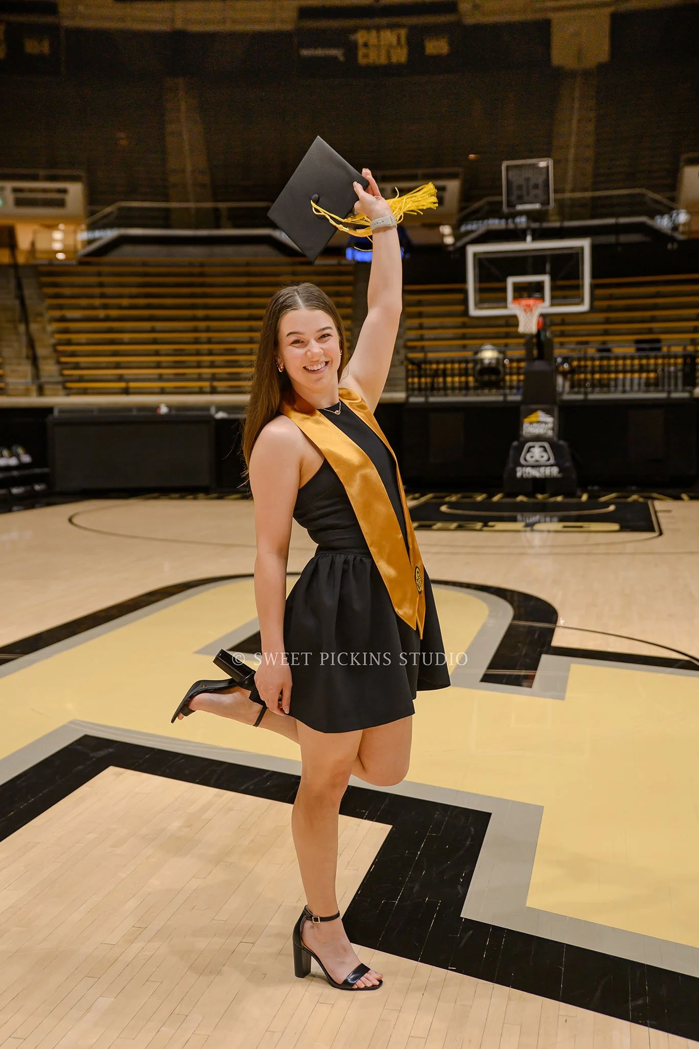 Ashelyn’s Purdue Graduation Portrait Photography for Sports Nutrition at Mackey Arena basketball court in West Lafayette, Indiana by Sweet Pickins Studio senior photographer Amanda Wilson © 2026