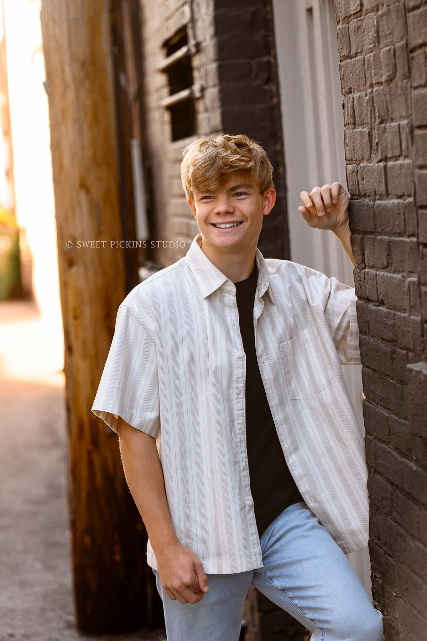 Noblesville, Indiana Fall Senior Photography in Urban Downtown for Noblesville High School class of 2026 senior guy by Sweet Pickins Studio senior photographer Amanda Wilson ©