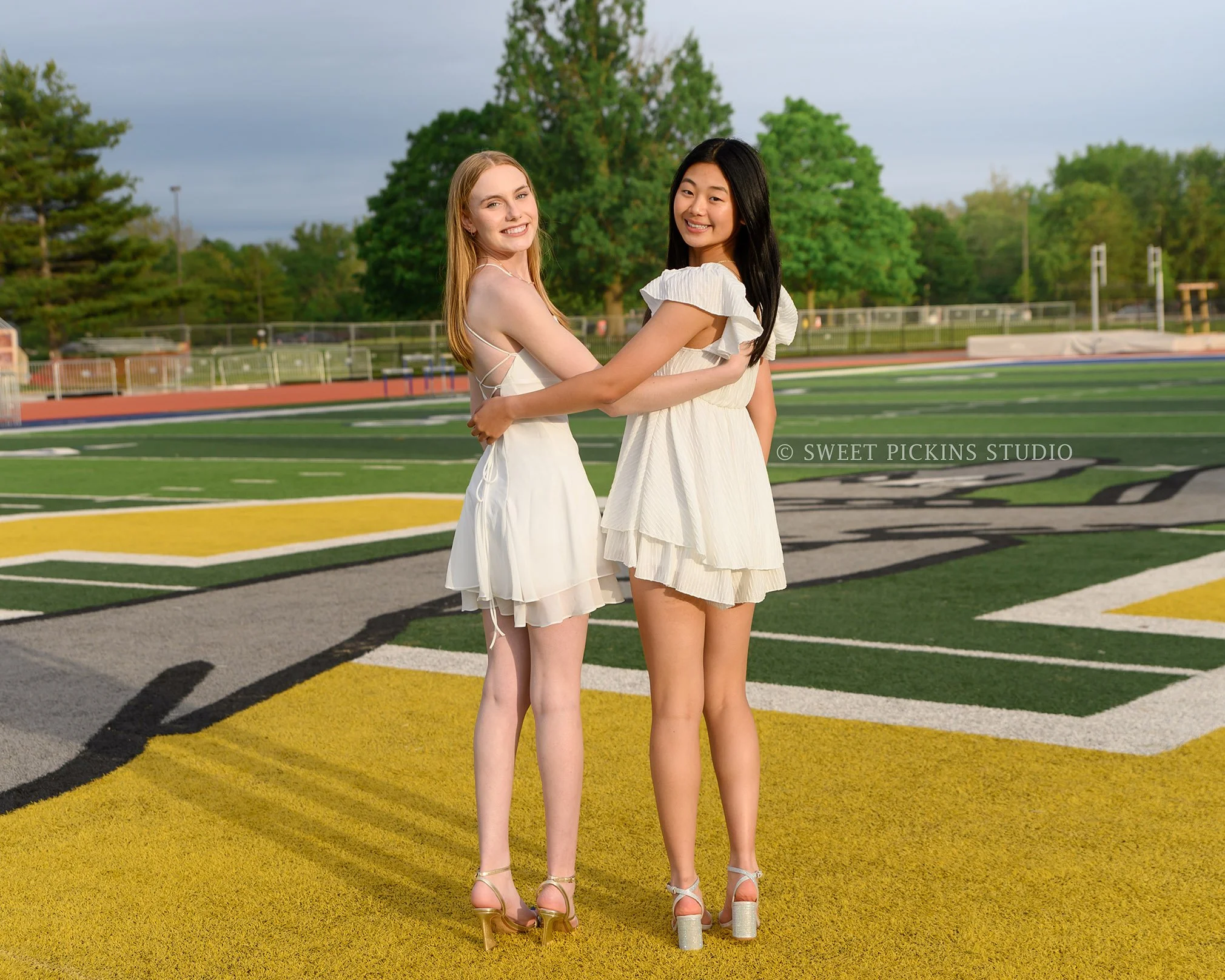 Holly and Taylor’s Carmel High School Graduation Photography in Cap and Gown for best friends by Sweet Pickins Studio senior photographer Amanda Wilson ©