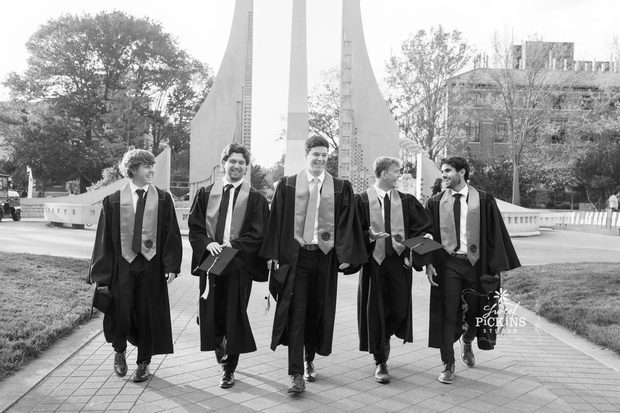 Purdue University Graduation Photography for Guys  in Cap and Gown at fountain on college campus by Sweet Pickins Studio senior photographer Amanda Wilson ©