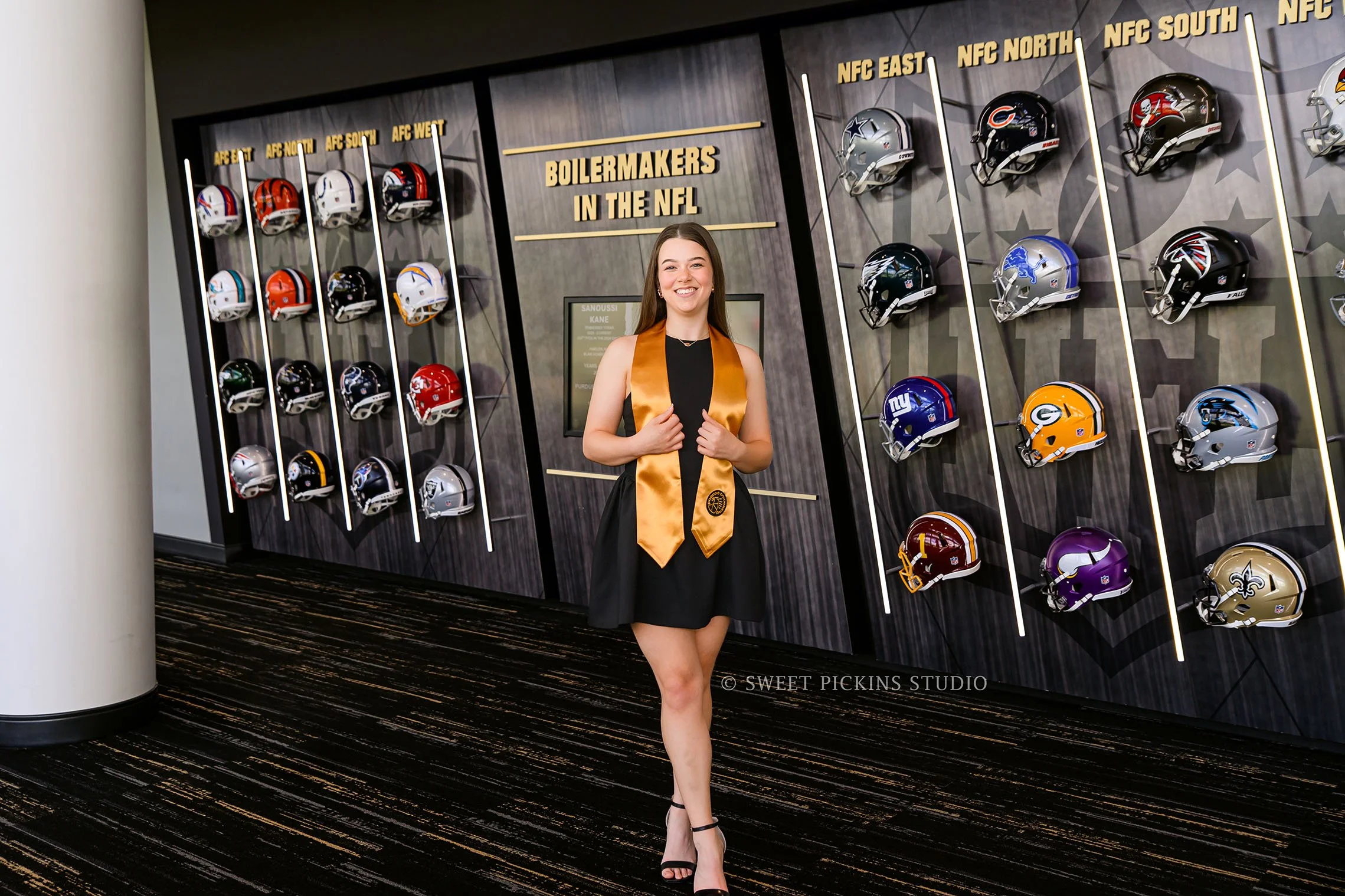 Ashelyn’s Purdue University Graduation Portrait Photography at Mackey Arena for sports nutrition graduate wearing cap and gown in West Lafayette, Indiana by Sweet Pickins Studio senior photographer Amanda Wilson © 2026