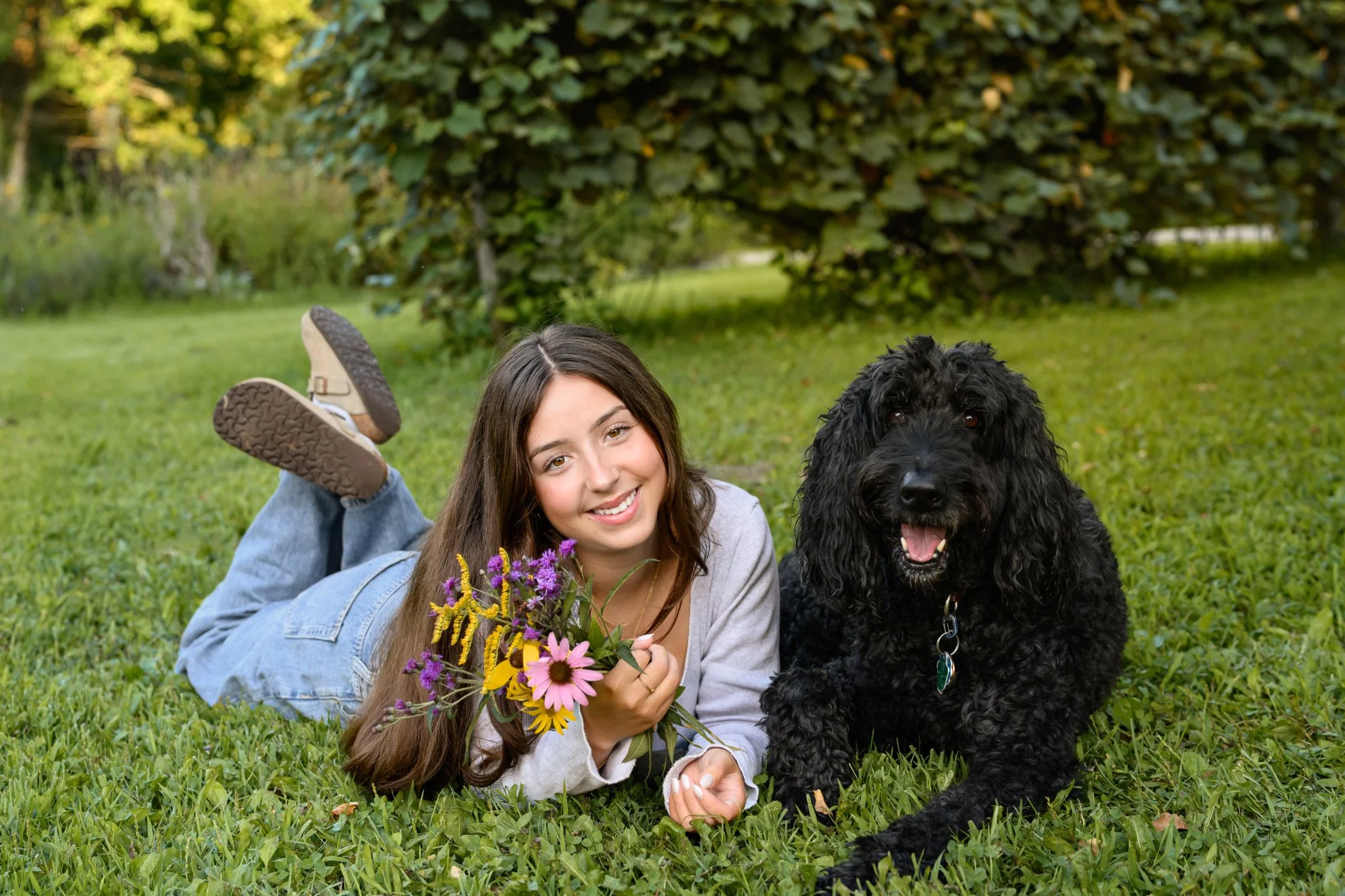 Maisie | Lakeville, Indiana Senior Portraits with Pet Dog for Madison East High School class of 2027 senior with flower bouquet by Peru Indiana senior photographer Amanda Wilson © Sweet Pickins Studio