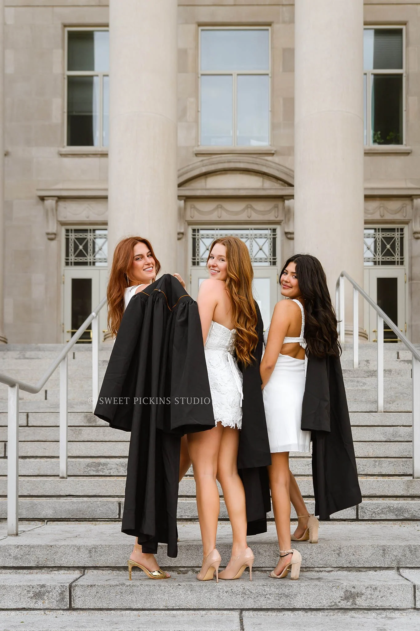 Purdue Graduation Photography for Sorority Sisters in West Lafayette, Indiana by Sweet Pickins Studio photographer Amanda Wilson for graduates posing in white dresses at Hovde Hall steps with cap and gowns © 2026