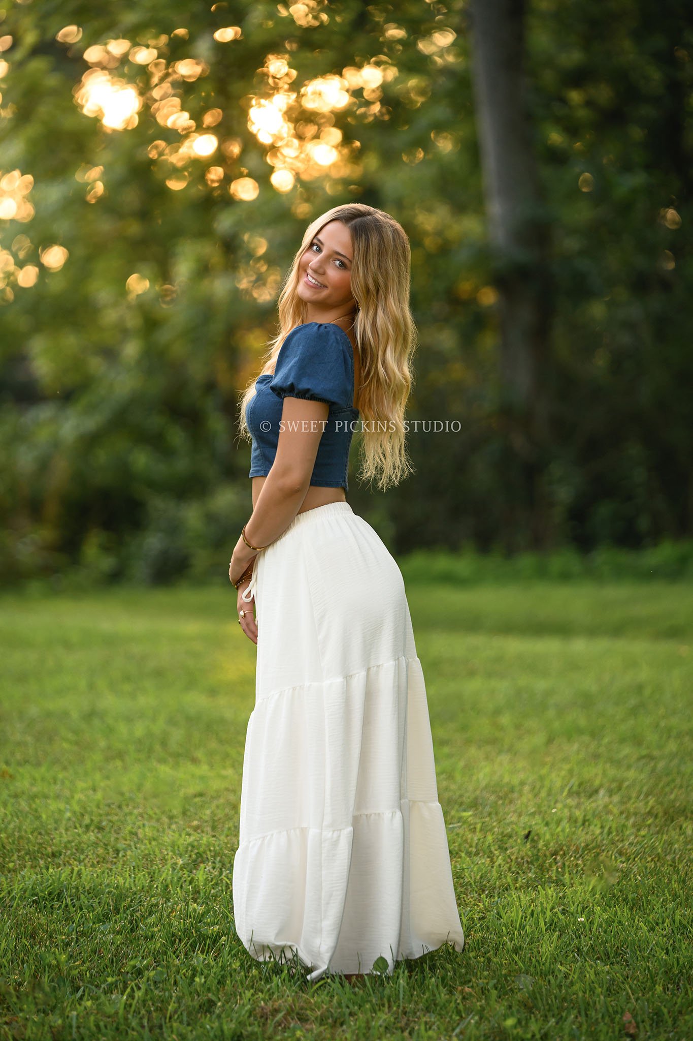 Addison’s Peru, Indiana Country Senior Photography at Sunset wearing denim top with white flowy skirt in nature location by Sweet Pickins Studio senior photographer Amanda Wilson  ©
