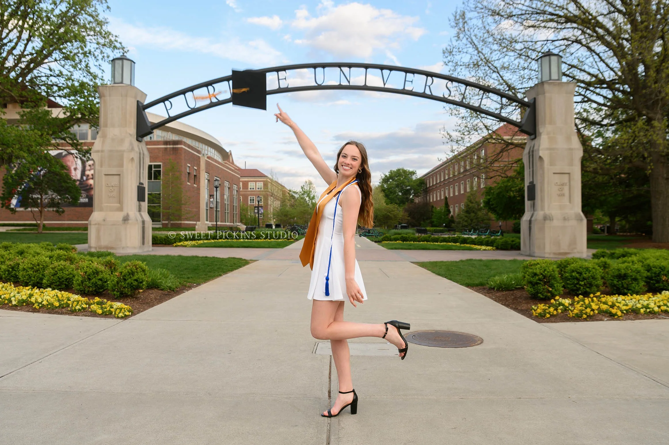 Katelyn’s Purdue University Graduation Photography in Cap and Gown at Engineering Arch in West Lafayette, Indiana by Sweet Pickins Studio photographer Amanda Wilson ©