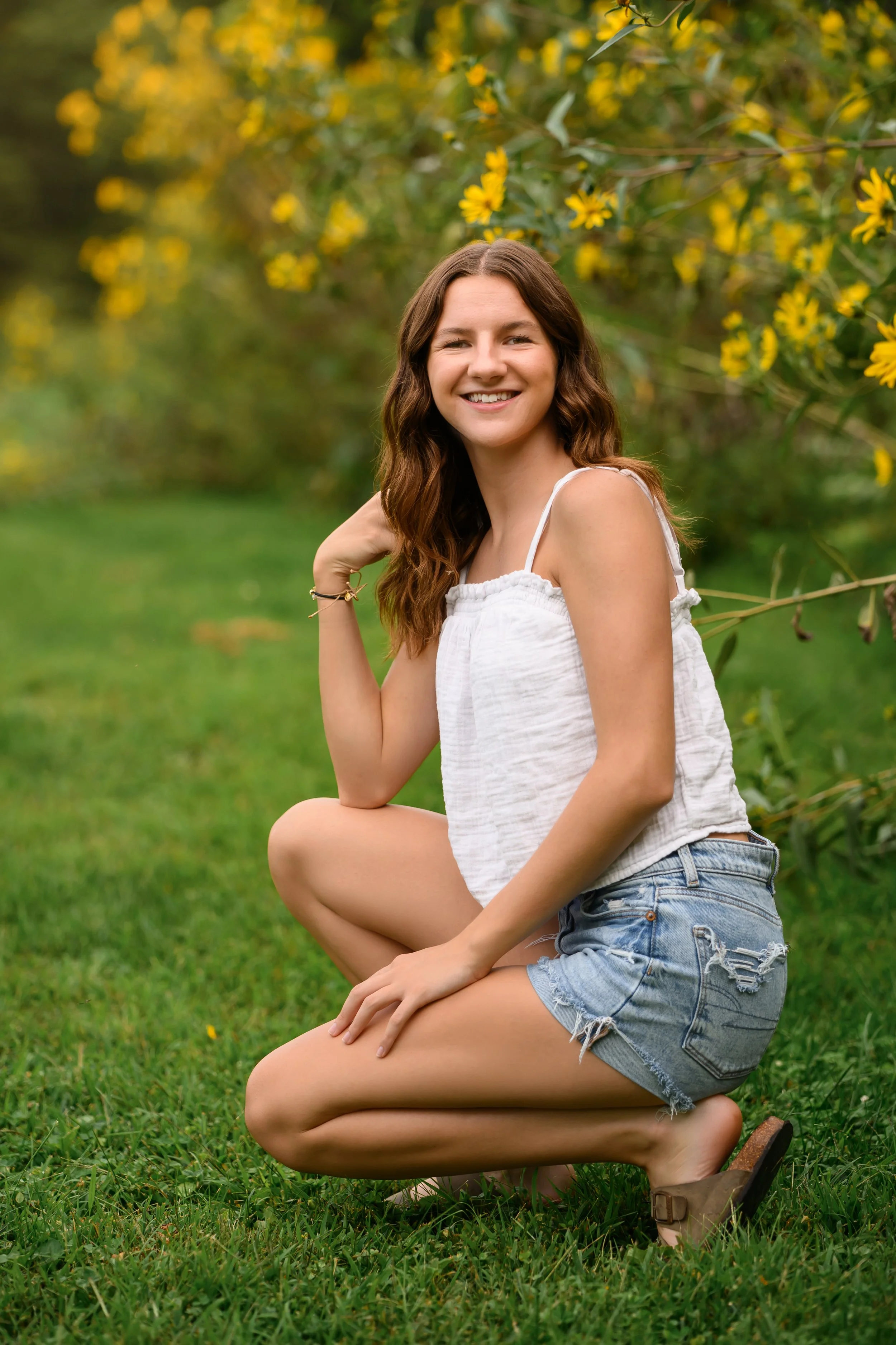 Kokomo, Indiana Senior Photography in yellow flowers for Maconaquah class of 2027 senior girl KASEY by Sweet Pickins Studio senior photographer Amanda Wilson ©