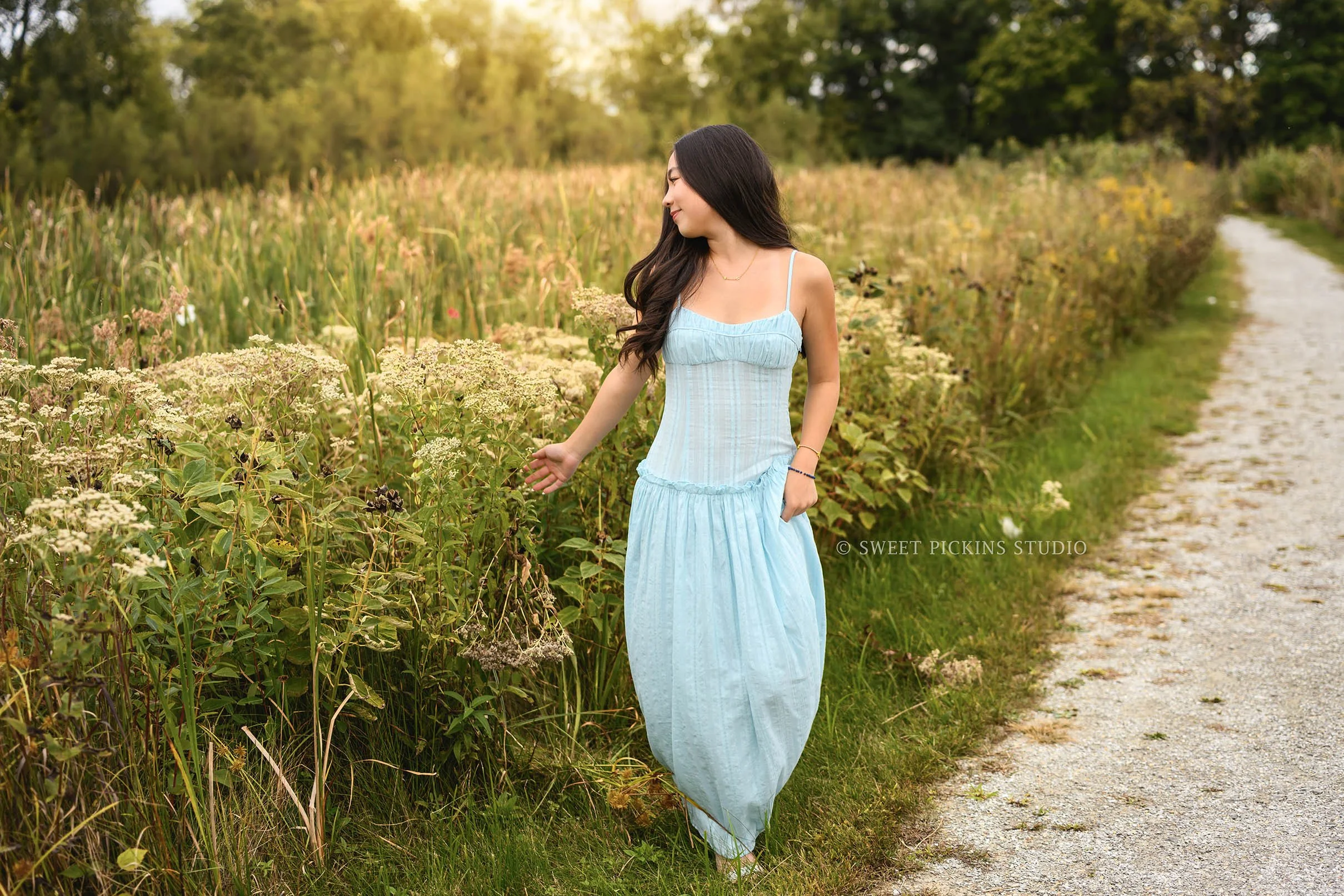 Nora | Carmel, Indiana Fall Senior Girl Pictures posing on nature path in golden grass field wearing blue dress for Park Tudor Class of 2027 by Sweet Pickins Studio senior photographer Amanda Wilson ©