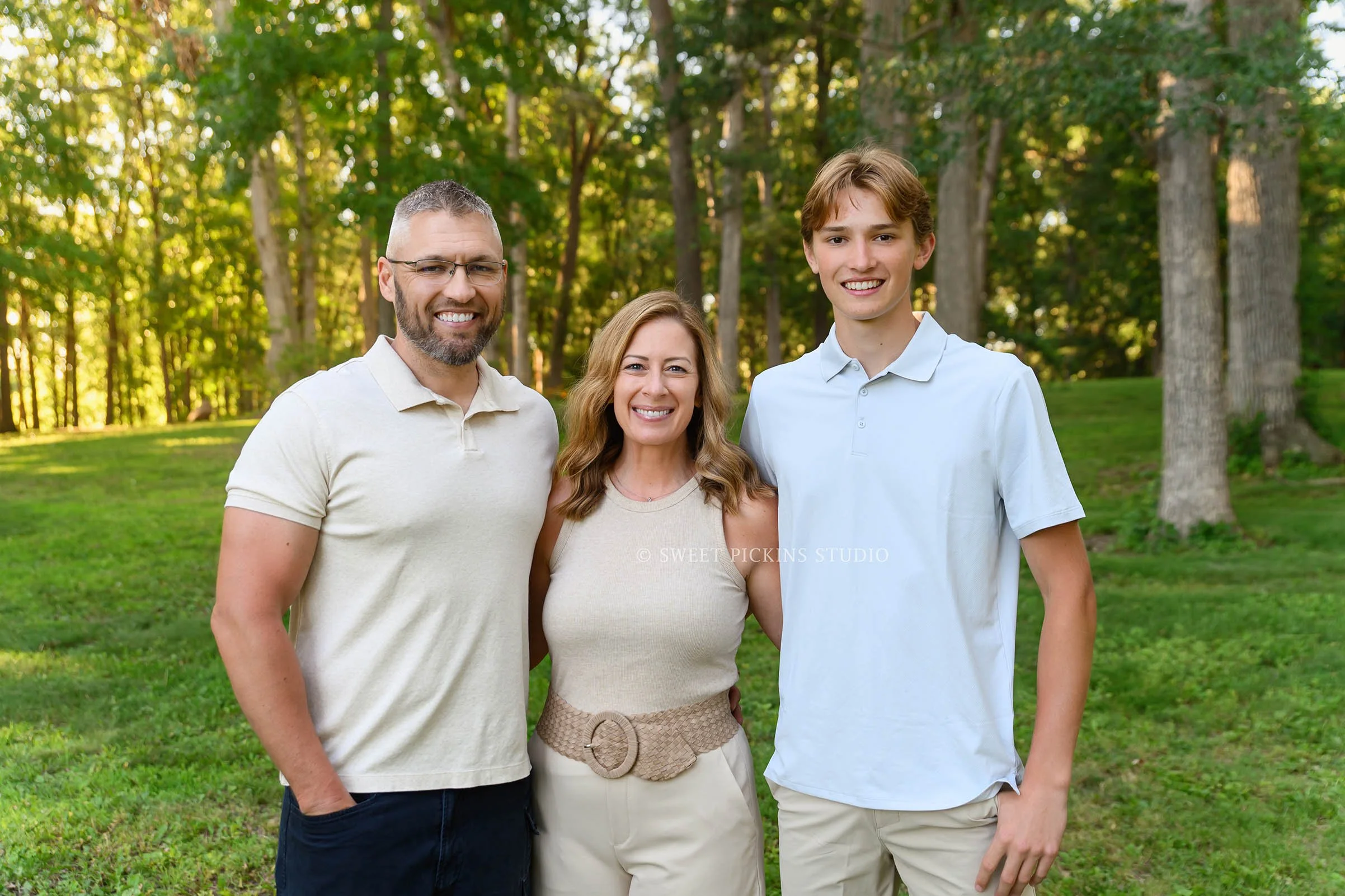 Roann, Indiana Family Portrait Photography for family of 3 wearing blue and beige outfits at Luken’s Lake outdoor nature location in summer by Sweet Pickins Studio family photographer Amanda Wilson ©