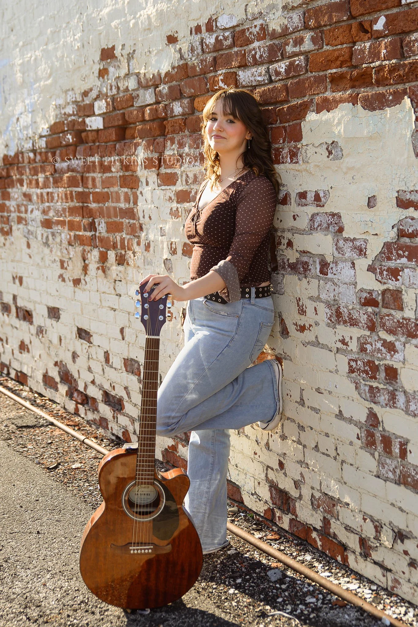 Hailee | Noblesville, Indiana Senior Portrait Photography in Urban Downtown for Noblesville High School class of 2026 senior girl with guitar in rustic alley by Sweet Pickins Studio senior photographer Amanda Wilson © 2026