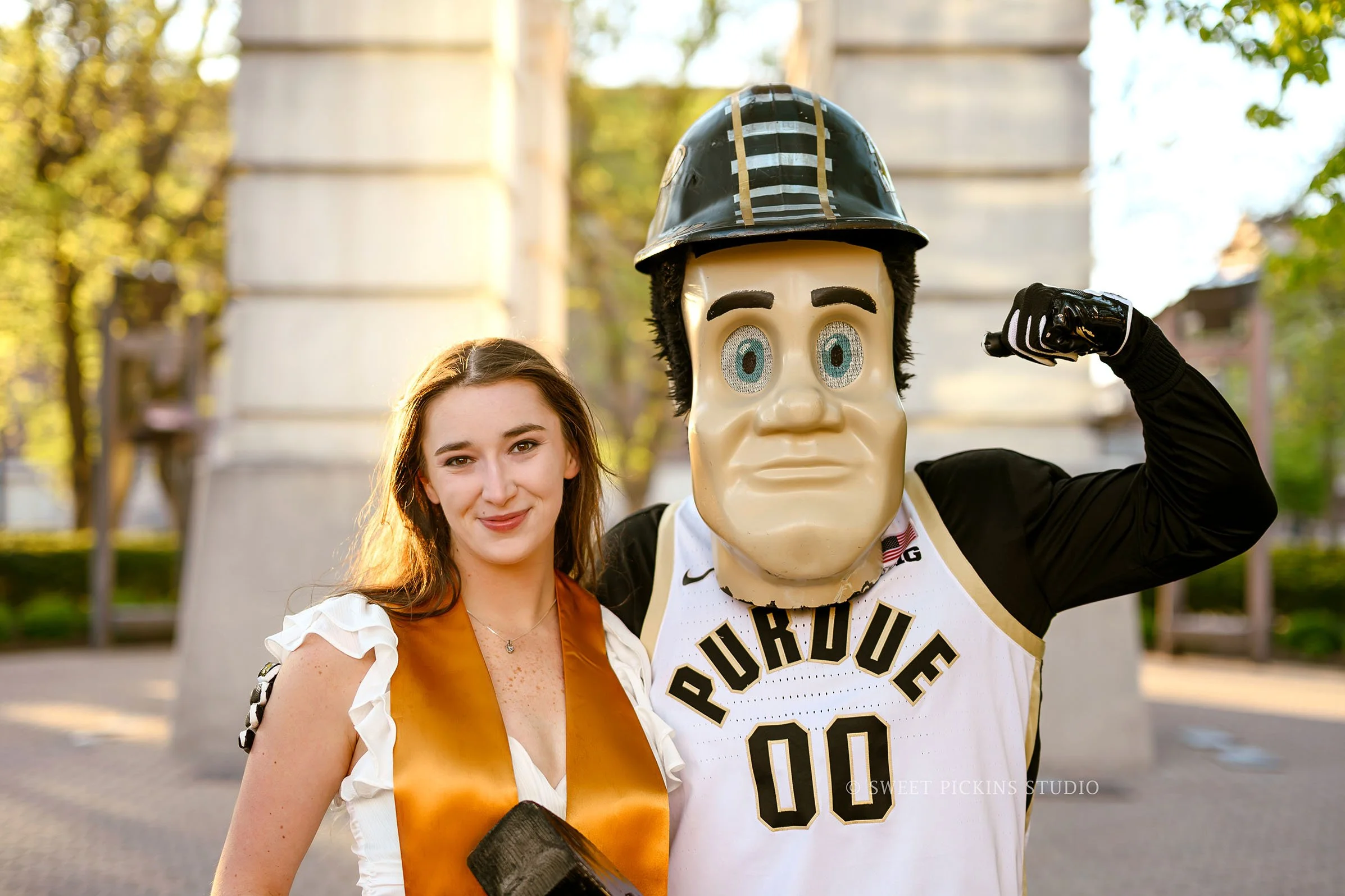 Emily | Purdue University Graduation Portraits in West Lafayette, Indiana at Bell Tower with Purdue Pete mascot wearing white dress in Spring by Sweet Pickins Studio senior photographer Amanda Wilson ©