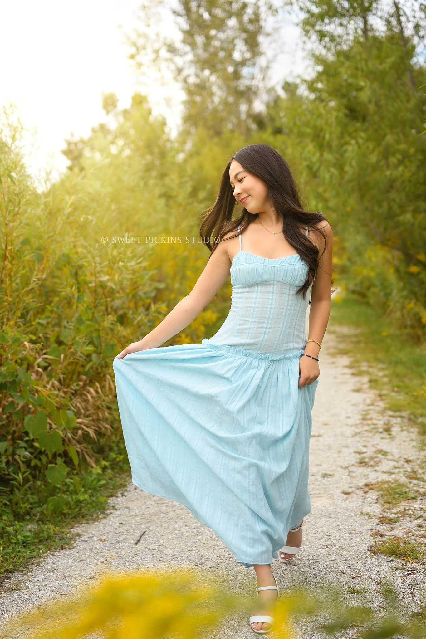 Nora | Carmel, Indiana Senior Girl Portraits in Fall field with yellow flowers wearing blue dress for Park Tudor Class of 2027 by Sweet Pickins Studio senior photographer Amanda Wilson ©