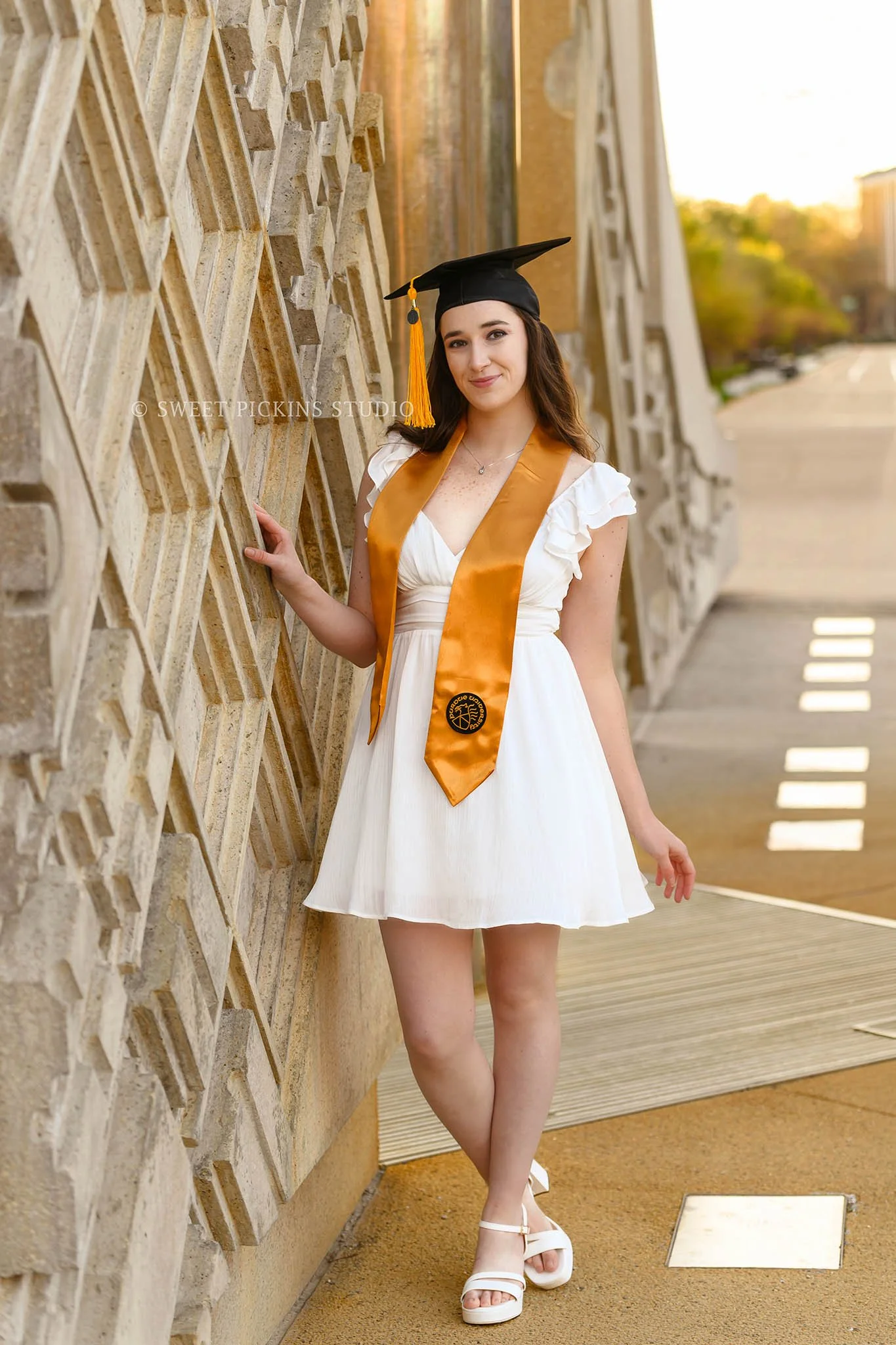 Emily | Purdue University Graduation Portrait Photography in Cap and Gown in West Lafayette, Indiana at Engineering Fountain wearing white dress in Spring by Sweet Pickins Studio senior photographer Amanda Wilson ©