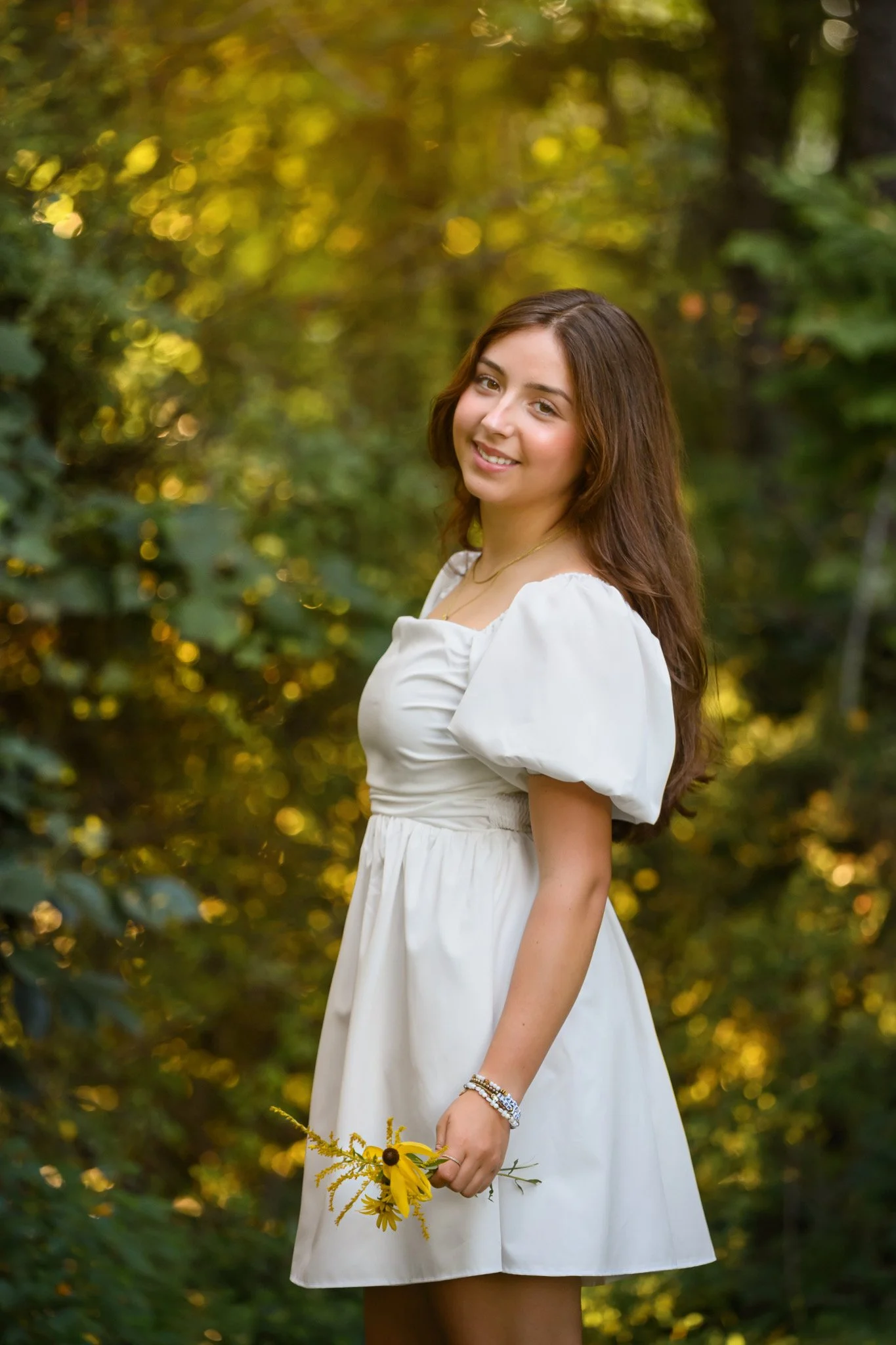 Maisie | Lakeville, Indiana Nature Senior Pictures for Madison East High School class of 2027 senior girl posing in white dress with flowers  by Peru Indiana senior photographer Amanda Wilson © Sweet Pickins Studio